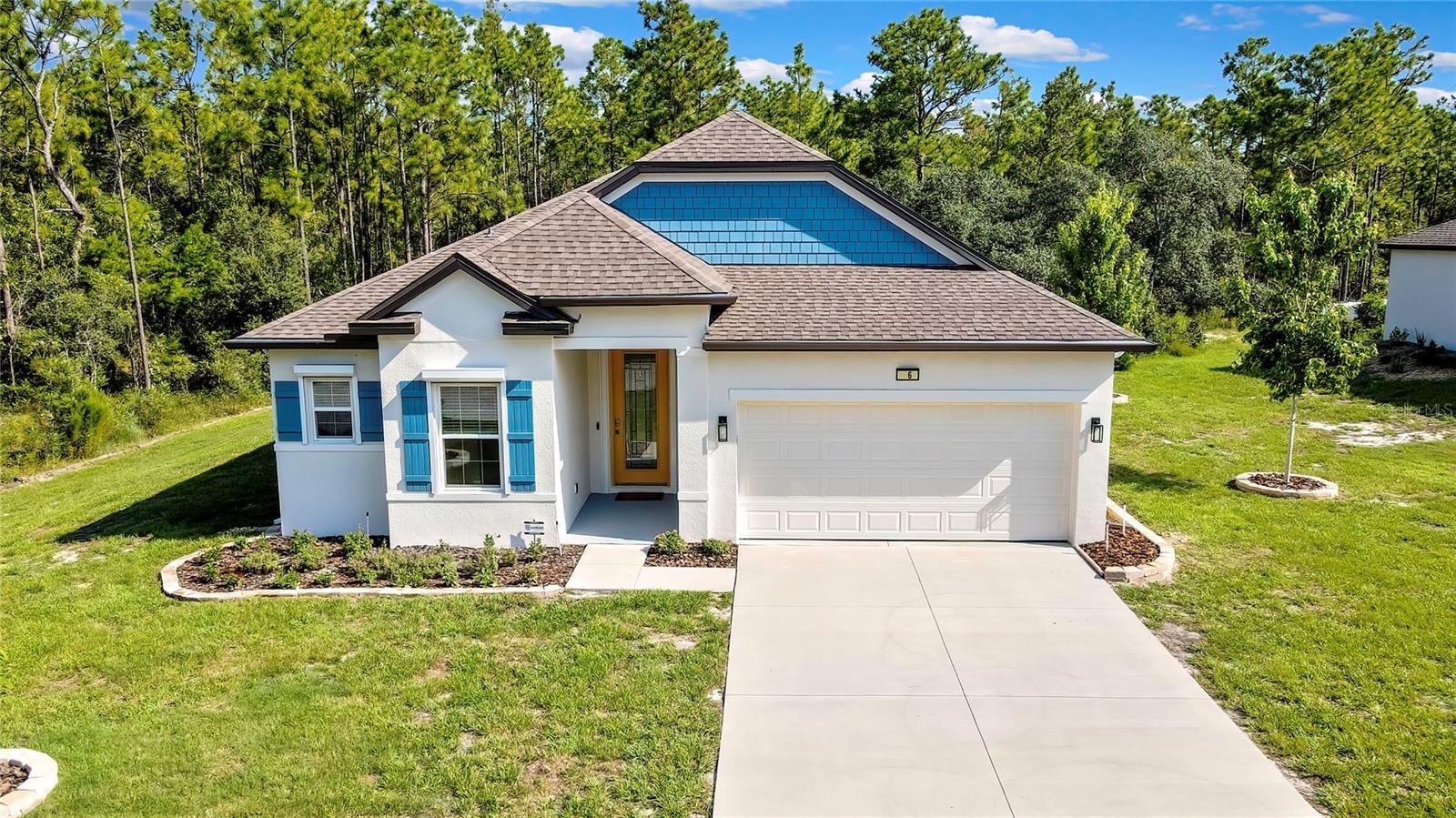 Better Than New – Upgraded 2023 Home on Quiet Greenbelt Lot in Sugarmill Woods. Why wait to build? This 2023 home is truly better than new, with upgrades and features that go far beyond builder-basic. Located on a quiet street in the highly desirable Sugarmill Woods community, this 3-bedroom, 2-bath, 2-car garage home backs to a deep greenbelt for added peace. Inside, you’ll find luxury vinyl plank flooring throughout—no carpet anywhere. The open floor plan includes crown molding in the main living areas and bedrooms, upgraded light fixtures, fresh paint, and dimmer switches throughout. The kitchen is equipped with granite countertops, white shaker cabinets, and upgraded stainless steel appliances. The second bathroom has been thoughtfully upgraded with a beautiful soaking tub and tiled surround. Out back, enjoy a screened lanai overlooking the quiet greenbelt. The landscaping is already established and supported by an irrigation system, with all-new gutters and downspouts in place. Built 99 feet above sea level, the home includes hurricane shutters for all doors and windows, a garage door opener with keypad and battery backup, custom window treatments throughout, hardwired smoke alarms, and a whole-house Guardian security system. Set in Florida’s Nature Coast, you're just minutes from fishing, kayaking, bike trails, shopping, dining, all within close proximity to Tampa. This is Florida living made easy—and better than new!