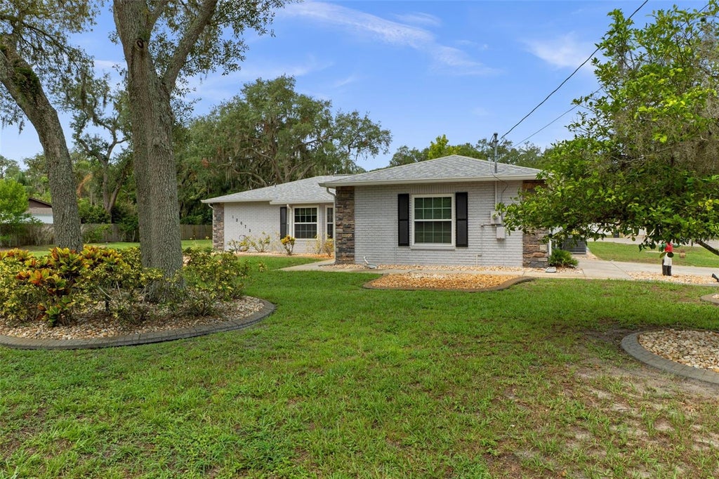 Photo of 12072 Lacey Drive, New Port Richey, FL 34654 (MLS # W7889519)