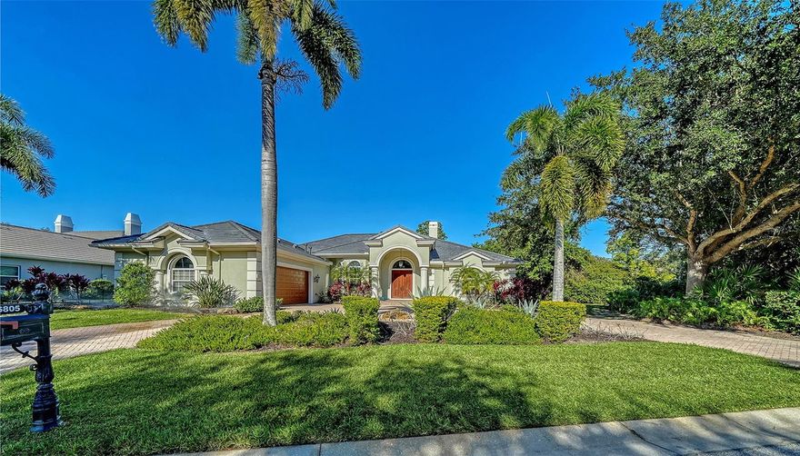 LOCATION, LUXURY, AND LIFESTYLE.  Set within the desirable and beautifully manicured community of University Park, this executive residence offers an impressive 3,851 sq ft of living space, on an exceptionally private preserve lot, a true sanctuary of peace and exclusivity. Custom-designed double wood entry doors welcome you into a bright, airy interior filled with natural light. The main living spaces have enriched wood flooring, crown moldings, custom built-ins, and a striking marble-surround fireplace which is perfect for cozy Florida winter evenings. The newly updated kitchen is a chef’s dream, featuring two built-in ovens, a 6-burner gas cooktop, custom two-tone cabinetry, quartz countertops, a stone tile backsplash, slate-topped center island, and top-of-the-line appliances. A large walk-in butler’s pantry provides exceptional additional storage. The kitchen’s updated design flows seamlessly into the spacious family room, highlighted by a custom-paneled feature wall and new tile flooring. Sliding doors open wide to the outdoor patio, extending the indoor living space, ideal for entertaining family and friends. The den/office offers additional custom built-ins and another set of sliders, filling the space with natural light and extending the living area onto a second covered outdoor retreat.  The expansive custom pool area is fabulous, designed for both relaxation and effortless entertaining. Enjoy one of the largest pools in University Park, complemented by a spa, a waterfall, lush decorative plantings, paved flooring and two covered outdoor seating areas ideal for year-round enjoyment. The outdoor kitchen makes gatherings a delight, while hurricane shutters provide added peace of mind.  Outside, a paved circular driveway leads to an oversized garage with impressive storage capacity and its own dedicated rear golf-cart access door.   Continuing through the home the primary suite is a luxurious retreat complete with custom moldings, tray ceiling, bay-window sitting nook, custom built-ins, and two oversized walk-in closets custom fitted with dressers and exceptional storage. The spacious primary bath includes a walk-in shower, a separate soaking tub, and dual vanities.  Having additional guest bedrooms thoughtfully located on the opposite side of the home for added privacy, are equally inviting. Each generously sized bedroom features charming bay-window sitting areas and convenient access to ensuite bathrooms.  This home offers an array of features, including an impressive utility room with abundant cabinetry and dedicated folding space, a desk/office area, a dry bar with a double wine cooler, central vacuum system, ample storage, and an oversized double garage complete with fitted cabinetry as well as a separate golf-cart parking area with door.  Major updates include a brand-new roof (2025), two A/C units (2018), 20kw whole house genterator (2024) and a hot water heater (2016), ensuring comfort and peace of mind.  All of this is nestled in a community known for its lush landscaping, refined ambiance, and newly remodeled amenities to include the clubhouse, championship golf course and pro shop, restaurant with al fresco dining, tennis facilities, and fitness center. Perfectly positioned near shops, dining, sports venues, downtown Sarasota, and world-famous Gulf beaches, this home delivers an unmatched blend of privacy, elegance, and convenience.  This home or community will not disappoint!