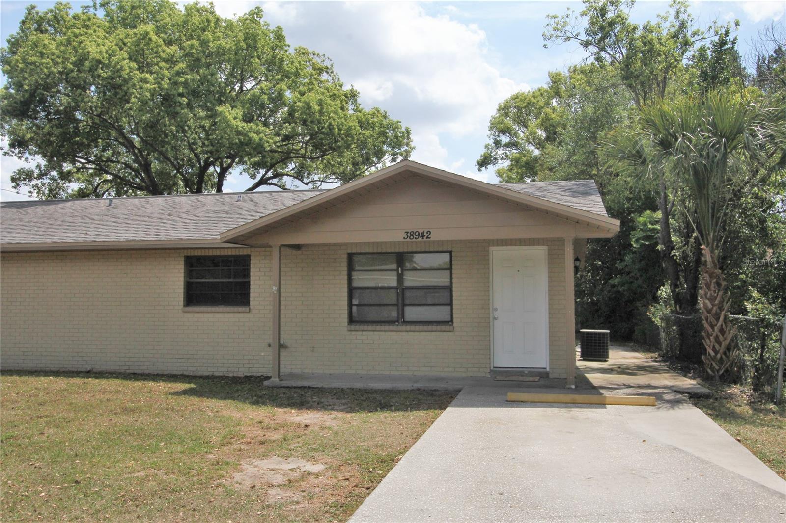 Well maintained 2 bedroom, 1 bathroom 1/2 duplex in the City limits of Zephyrhills. Unit has it's own utility room with washer and dryer. There's a small front porch as you walk in the front door and a back patio when you go out the back slider.
Full background and credit checks are run on all tenants 18 years and older. Combined income must be at least 3x's the rent amount ($4,350). No Evictions. Pets are considered on a case by case basis (if accepted there will be additional pet fees), no aggressive breeds allowed. Move in funds: 1st Month's rent, Security Deposit (one month's rent) and any applicable pet fees. Utilities are not included.