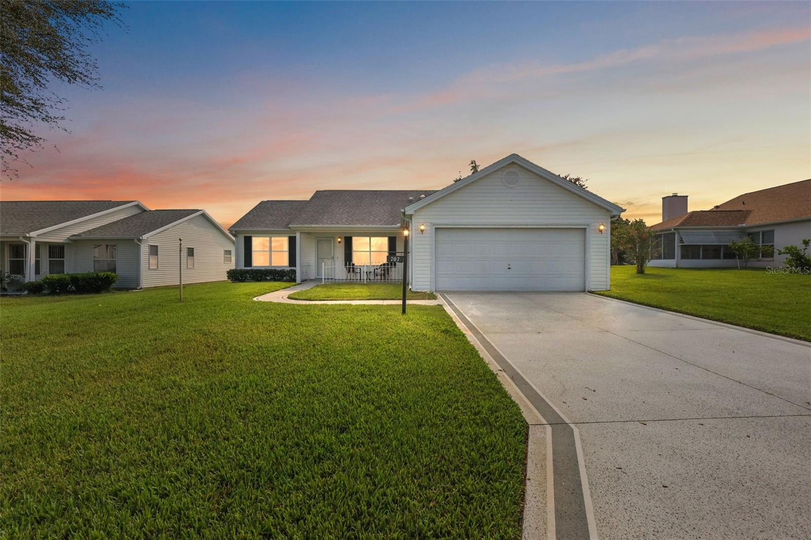 Wonderful TURNKEY 2/2 Catalina with ENCLOSED LANAI and PRIVACY LANDSCAPING in the quaint Village of Rio Grande! GOLF CART INCLUDED. Just bring your toothbrush! CONVENIENTLY LOCATED - JUST MINUTES to BOTH Spanish Springs Town Square and Lake Sumter Landing! BOND PAID! A lovely front porch and painted walk and driveway add to the exterior charm of this AMAZING home! Step inside to discover the SPECTACULAR OPEN CONCEPT FLOOR PLAN of the living, dining and kitchen areas. RICH, WARM, WOOD LAMINATE floors grace the living and dining areas. The AMAZING kitchen boasts TILE floors, WOOD cabinetry, TILE backsplash, and a generously sized CENTER ISLAND with ADDITIONAL cabinets for ABUNDANT STORAGE. From the dining area, step through SLIDING GLASS DOORS into the FABULOUS ENCLOSED LANAI with a plethora of windows for an ABUNDANCE of natural light. This FANTASTIC room features solar shades and rear PRIVACY landscaping creating the perfect spot to entertain family and friends! The adjacent REAR PATIO is ideal for grilling, or simply RELAXING and enjoying the beautiful Florida sunshine! Back inside, the primary bedroom offers a LARGE WALK-IN closet and LAMINATE floors. It’s EN-SUITE bathroom boasts a WHITE vanity with DOUBLE sinks, WALK-IN shower with GLASS doors, TILE floors, and a LINEN closet. Designed for privacy, the SPLIT FLOOR PLAN creates a SEPARATE GUEST WING with an additional bedroom featuring DOUBLE windows and a built-in closet. The second bathroom is thoughtfully appointed with a WHITE vanity, TILE flooring, SOLAR TUBE, and a LARGE hallway LINEN closet for added storage. An INTERIOR LAUNDRY room with TILE floors, SOLAR TUBE, shelving, and a utility sink provides both functionality and convenience. Directly off of the laundry room you will find a SPACIOUS two-car garage offering additional shelving, attic access with stairs, and plenty of room for parking! DON’T MISS THE OPPORTUNITY TO MAKE THIS INCREDIBLE HOME YOUR OWN! Located just 1/2 mile to the Rio Grande Neighborhood Pool and minutes to County Road 466 with with an abundance of shopping, restaurants, banks, and medical and more! Close to three large Regional Recreation Centers: Laurel Manor (7 min.), Savannah Center (9 min.) & La Hacienda (4 min.); several Country Clubs and Championship Golf Courses: Tierra Del Sol (4 min.), Hacienda Hills (3 min.) & Orange Blossom Hills (7 min.); and more. PLEASE WATCH OUR WALKTHROUGH VIDEO OF THIS WONDERFUL TURNKEY HOME in an AMAZING LOCATION and CALL TODAY to schedule your Private Showing or Virtual Tour!