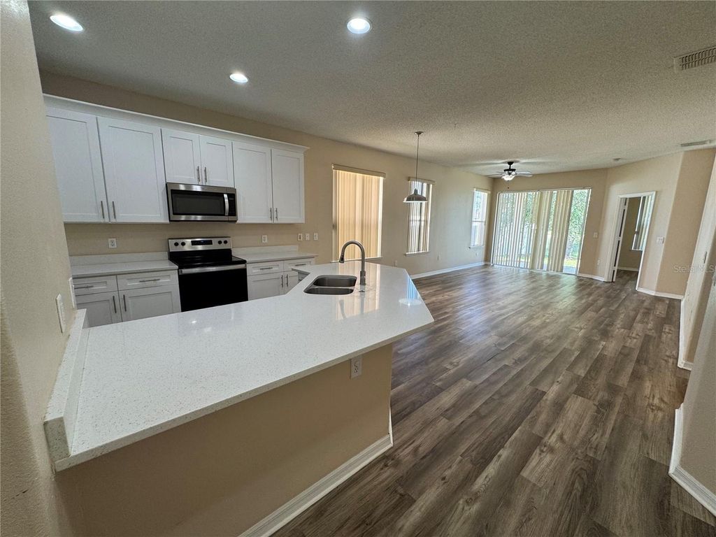 Photo of 14908 Huntcliff Park Way, Orlando, FL 32824 (MLS # O6400953)