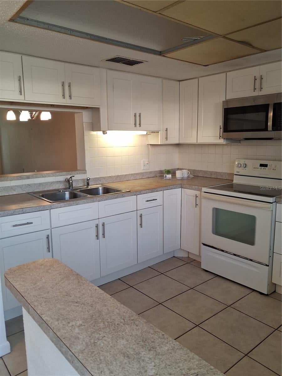 Photo of 831 Maple Court #103, Dunedin, FL 34698 (MLS # TB8561016)