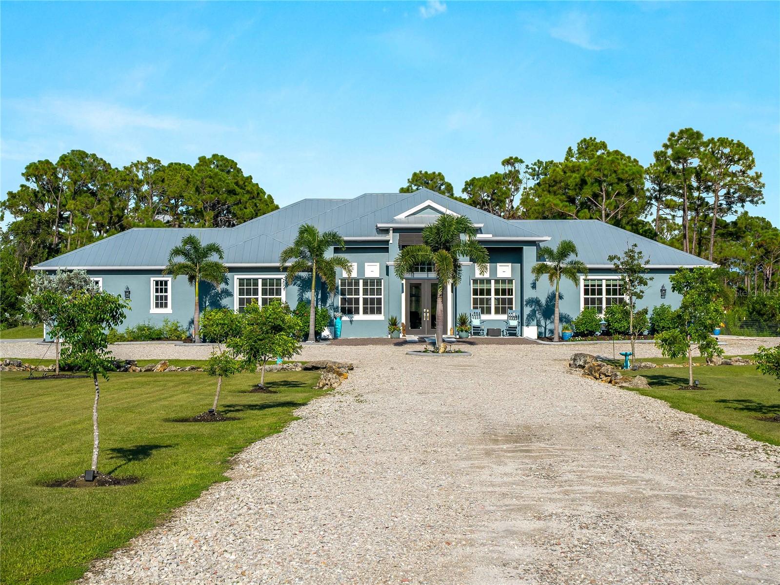 NEW and IMPROVED PRICE, WITH A HUGE REDUCTION!!! Location, Location, Location — Lake Geraldine Welcome to your dream home in the exclusive gated community of Lake Geraldine, where privacy, tranquility, and unbeatable convenience come together on a sprawling 3+ acre estate. Nestled at the end of a majestic 200-ft Mahogany tree-lined driveway, this custom-built residence offers 3 bedrooms, 3 bathrooms, a private office, spacious media room, and a fully equipped mother-in-law suite with its own entrance and summer kitchen—perfect for multi-generational living or hosting guests. Home Highlights: • 3,156 sq ft of beautifully designed living space • Saltwater heated pool with Pebble Tec finish and sun shelf for true resort-style relaxation • Extended covered lanai with elegant wood ceiling, ideal for morning coffee or evening gatherings, also is pre-plumbed for an Outdoor Kitchen. • Chef’s kitchen featuring an oversized Calacatta Classique quartz island and high-end finishes • Luxurious primary suite with a soaking tub and step-in shower • Coffered ceilings, crown molding, and 8-ft doors throughout the home • PGT impact-resistant windows, Metal roof, and Storm Smart remote-controlled shutters on rear lanai to provide additional shade and protect your furniture from the elements. • Fireplace in Great Room, • Ceiling fans in every room, and dedicated laundry room • Whole House Water Softener System and Undermount Reverse Osmosis • Epoxy-finished 2-car garage with overhead Safe Racks for added storage Lush, irrigated landscaping and fully fenced-in backyard—perfect for pets or children • Low HOA fees, RV & boat parking allowed, and Ring Camera Security System for peace of mind Bonus: Mother-in-Law Suite Private entrance, full bedroom, bathroom, kitchen, and living space—ideal for extended family, guests, and possible income opportunity. Prime Location: Less than 5 miles from Downtown Wellen Park, enjoy: • Publix, boutique shops, and top-rated restaurants • Costco’s Store with Gas/Liquor • Food trucks, coffee & ice cream shops • Splash pad, immaculate restrooms, and a large playground for children • Free Friday concerts on the Solis Hall lawn • 80-acre lake with miles of trails, fishing spots, and kayak rentals • Cool Today Park home to the Atlanta Braves Spring Training • Fire & Police Station + Brand New HCA ER Facility • A+ rated Sarasota County K–12 school campus opening Aug 2026 less than a mile away. • Just approved Manasota Beach Rd extension will provide direct access to Manasota Key Beach from your front gate. This rarely available gem offers a perfect balance of luxury, comfort, and location. Whether you’re raising a family, entertaining guests, or seeking a peaceful retreat close to the best of Sarasota County, this is the home that truly checks every box. Experience the lifestyle Lake Geraldine has to offer!!!