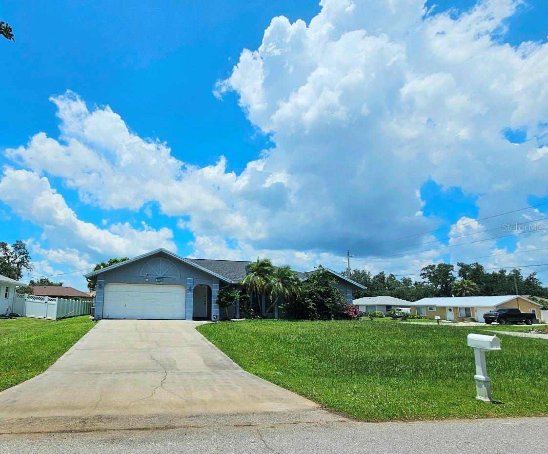 Explore this spacious 3-bedroom pool home located in the heart of Port Charlotte. This home is just under 1800 Sq. Feet under air and sits on corner lot. Upon entry of the home, you come into the Living room. Kitchen comes with side-by-side refrigerator with ice maker. Appliances include range, dishwasher, countertop microwave, Kitchen is open to the formal dining room. The dining room has sliders that open to the pool area. The master bedroom with ensuite Master Bathroom has a double vanity sink, walk in shower and walk in closet. Bedroom 2 & Bedroom 3 with walk in closet. Guest bath has tub/shower combo, access door to the pool area. Washer/Dryer located in the 2 car garage. Covered area on the pool deck for sitting out of the sun, then jump in the pool to cool off. This home has ceramic tile flooring throughout. Roof Replace 12/2021: Hot Water Heater 2023: