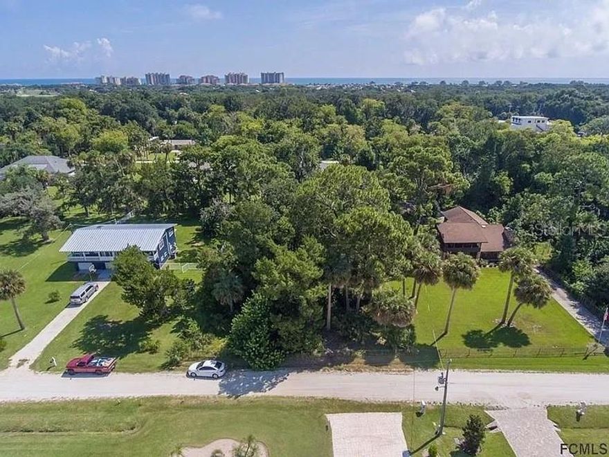 Owner financing is available with a substantial down payment. An Incredible opportunity to own a significantly sized lot across from the INTRACOASTAL. Nearly a half-acre lot with mature trees on a quiet, dead-end street. A great fit for a dream home or as an investment. The lot is ready to be cleared and built on. No HOA and does have short-term rental privileges. RV's and boats are allowable on property.
