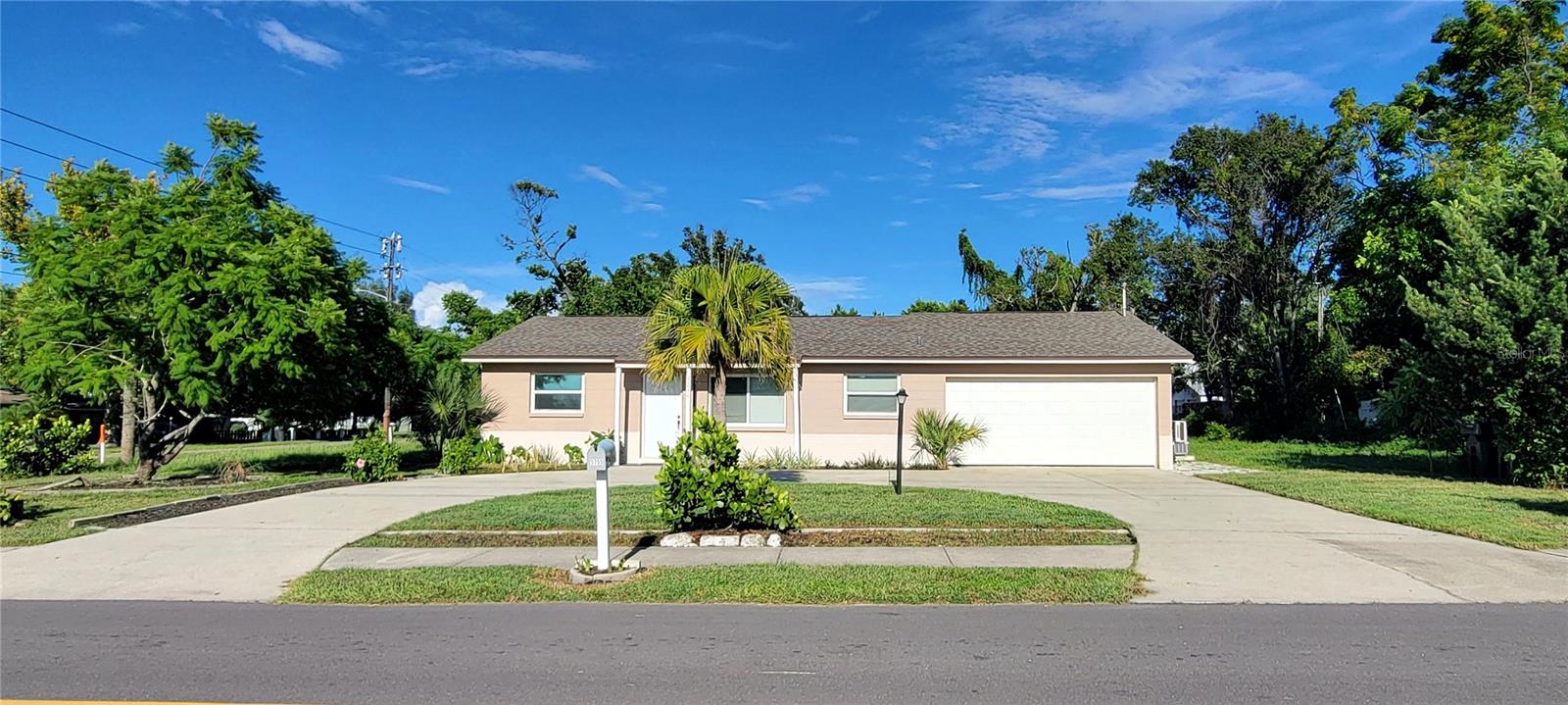 This move-in ready, 3 bedroom, 2 full bathroom cement block home sits high and dry (40 feet elevation) on a large double size corner lot (X zone) that did not experience ANY flooding during the 2024 storms and also did not lose power. The main features of this home include new hurricane windows and sliding glass door (2023), a newer roof (2021) and a fully paid off solar panel system (2023) that will save you a lot of $$$ money on your monthly electric bill!
The 1,468 square foot floor plan is very open and has a split bedroom design. The kitchen has newer cabinets, stainless steel appliances and a combination of granite and butcher block style counter tops. The home is centrally located 15 minutes from downtown St Petersburg, 15 minutes from the beach and 20 minutes from the Tampa airport. This is an attractive, versatile home that can suit the needs of many home buyers. Make your appointment to see this home today!