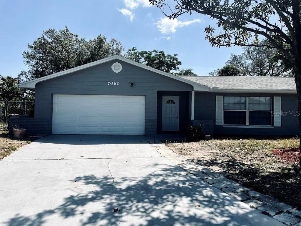 Photo of 7060 Scruboak Lane, Orlando, FL 32818 (MLS # O6372505)