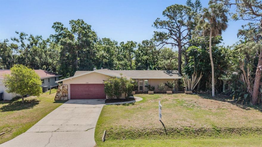 Charming Sarasota home offering a bright, open layout and great indoor-outdoor living! This well-maintained property features spacious living and dining areas with durable tile flooring throughout, creating a seamless and low-maintenance living space filled with natural light.

The updated kitchen showcases granite countertops, modern cabinetry, stainless steel appliances, and a convenient pass-through/breakfast bar—perfect for everyday living and entertaining. Multiple living areas provide flexibility for a family room, dining space, or home office setup.

Step outside to a large screened-in lanai, ideal for relaxing or hosting guests while enjoying the private backyard setting with lush greenery. The yard offers plenty of space to personalize and make your own outdoor retreat.

Additional highlights include a 2-car garage, generous driveway, and a functional layout with comfortable bedroom spaces. Conveniently located in Sarasota near shopping, dining, and major roadways, this home offers both comfort and accessibility.

Great opportunity to own a versatile home in a desirable Sarasota location—schedule your showing today!