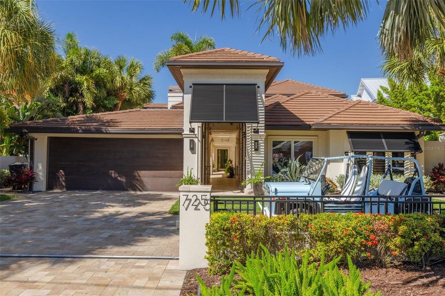 A rare expression of modern luxury and timeless coastal elegance, this extraordinary waterfront estate is nestled in the highly sought-after enclave of Snell Isle in Northeast St. Petersburg. Perfectly positioned on Tampa Bay with unobstructed water access and no bridge restrictions, this property offers an unparalleled boating lifestyle with seamless access to the open waters of Tampa Bay & the Gulf of America.  Completely renovated, reimagined, and restored in over the last 5 years, the residence lives like a true work of art — where every finish, texture, and architectural detail has been intentionally curated. Fully protected with impact windows and doors, the home welcomes you through dramatic arched steel double entry doors into a world of refined sophistication and resort-style living.  Expansive EuroWall folding doors dissolve the boundary between interior and exterior spaces, creating a breathtaking indoor-outdoor experience flooded with natural light and panoramic water views. At the heart of the outdoor living area, a stunning double-sided gas fireplace connects seamlessly to the outdoor grille and entertaining space, all sheltered beneath a remote-controlled pergola for year-round enjoyment.  The gated entry opens to an impressive motor court with an additional parking pad, while lush mature landscaping and concrete block privacy walls create a serene and secluded setting. A tranquil copper fountain in the entry courtyard provides a zen-inspired retreat and is complemented by a nearby spa-like Japanese bath featuring a soaking tub for ultimate relaxation.Designed for both elevated entertaining and effortless everyday living, the home features a sprawling media room complete with a 110-inch projection screen and movie bar, a custom temperature-controlled wine cellar, and a striking bespoke bar with with Agate countertops & Cristallo backlit stone accents. The brand-new designer kitchen showcases custom cabinetry, stunning Titanium Gold granite countertops, and a premium appliance package featuring Monogram and Wolf appliances.The luxurious primary suite offers a true private sanctuary with a spa-inspired bathroom featuring a custom walk-in shower enclosed with steel door, an oversized soaking tub, and an adjacent dedicated workout room. Outdoors, the gorgeous resort-style pool and spa embody the quintessential Florida lifestyle with dramatic water features, fountains, and a slide perfect for entertaining family and guests alike. Along the waterfront, a new concrete seawall with metal fencing leads to an expansive composite dock equipped with multiple boat lifts, including a 10,000-pound lift and a 20,000-pound rated G6 super-fast lift — a dream setup for the avid boating enthusiast.There are simply too many remarkable features and custom details to list. This one-of-a-kind waterfront masterpiece must be experienced in person to truly appreciate its extraordinary craftsmanship, design, and lifestyle.