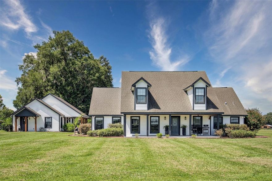 Welcome to your dream equestrian estate! This magnificent 30.6-acre horse farm is a paradise for horse enthusiasts and offers a remarkable blend of luxury living and equestrian amenities. Nestled in a high and dry location with no flood zones to worry about, this property is truly one-of-a-kind. As you step into the main house, you'll be greeted by a beautifully renovated 4-bedroom, 3.5-bathroom home designed with your comfort in mind. The master bedroom and bathroom are conveniently located on the first floor, providing easy access and privacy. There is also a 2nd ensuite on the first floor perfect for another master suite or private guest quarters. With high ceilings, the home exudes an air of grandeur and spaciousness. Features like two water heaters, a cozy fireplace, and a 1000-gallon propane tank generator ensure that your daily living is as convenient as it is luxurious. Imagine hosting gatherings in your screen-enclosed swimming pool area with an outdoor bar and entertainment space. Connected to the main house is a charming guest house with 1 bedroom and 1 bathroom. It even boasts its own laundry room & generator, ensuring your guests' comfort and independence. This property is a horse lover's dream come true. It's perfectly set up for a training operation with two large barns. The main center-aisle barn offers 16 stalls, complete with tack rooms for all your equipment and a modern 6-horse Eurociser for exercising and conditioning your horses. The second barn comes with 9 stalls, providing ample space for your equine companions. Each barn is complemented by a 60' round pen for additional training options. For those who love to watch and appreciate the art of riding, there's a 100' x 200' arena with a covered viewing platform. Additionally, there's a second 120' x 120' shaded arena for comfortable practice in any weather. The property also offers spacious turnouts, including 5 1/2-acre grass paddocks, 8 1-3-acre grass paddocks, and a generous 12-acre grass pasture. All of these areas are equipped with automatic waterers and run-in sheds, ensuring the well-being of your horses. For guests or visiting trainers, there are 5 complete RV hookups with electric and septic connections. A 250-gallon propane generator is in place for the main barn, providing added peace of mind. A detached garage with a workshop rounds out this fantastic property, offering plenty of space for your hobbies and projects. This horse farm is a rare find, offering a harmonious blend of luxury living and world-class equestrian facilities. Don't miss the opportunity to make it your own and start living your equestrian dreams today. Schedule a showing and experience the magic of this remarkable property for yourself!