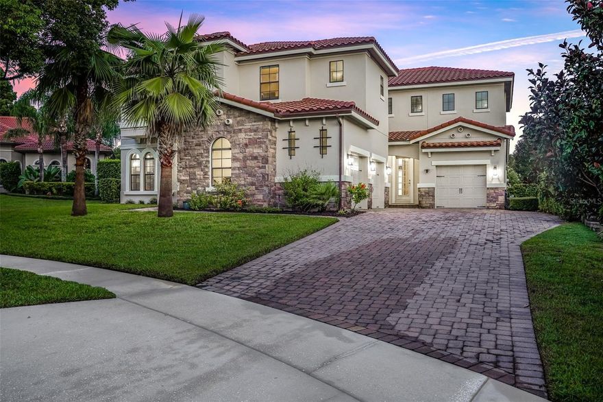 Welcome to the award-winning, amenity-rich, and 24-hour GUARD-GATED community of Lake Forest! Constructed in 2012, this impressive 4,277 sq. ft. residence offers a thoughtful two-story design with the primary suite conveniently located on the main level, while three additional bedrooms, a spacious loft, and a 25x19 bonus/media room(with projector) with granite wet bar await upstairs. The chef’s kitchen boasts a walk-in pantry, stainless steel appliances, built-in oven and microwave, and an oversized center island ideal for entertaining. The family room features soaring two-story ceilings, custom built-in entertainment shelving, an electric fireplace, and panoramic views through pocket sliders that open to the heated pool, spa, and summer kitchen—all within a screened enclosure complete with paver patio and generous covered seating. Both the primary suite and living room are enhanced by cozy electric fireplaces that create an inviting ambiance. The first floor also includes a formal dining room, a versatile flex space (perfect for an office, den, or fitness room), a half bath, pool bath, and laundry room, plus a unique tiled area designed for a pet retreat or play zone. Upstairs, two bedrooms share a Jack-and-Jill bath, while a third enjoys a private en-suite. Additional highlights include split garages (2-car and 1-car), a durable tile roof, newer interior and exterior paint, and a prime elevated cul-de-sac location. Lake Forest residents enjoy a 24-hour manned gate and an array of resort-style amenities, including a 10,000 sq. ft. clubhouse with a newly renovated fitness center, Jr. Olympic swimming pool, spa, kiddie pool, playground, lighted tennis and pickleball courts, sports courts, and a 55-acre private spring-fed lake with fishing pier. The community has also been recognized as a Certified National Wildlife Habitat and has recently added a butterfly and pollinator garden. Zoned for top-rated Seminole County schools, this home offers the perfect balance of luxury, lifestyle, and location close to everything Central Florida has to offer!