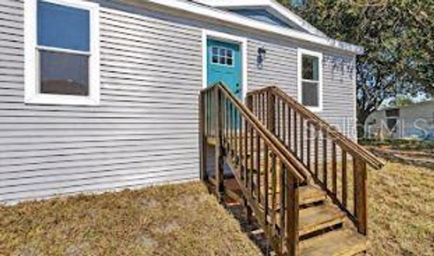 Experience the perfect blend of modern living and natural beauty with this BRAND-NEW manufactured home, situated on your own lot, which is just under a 1/4 acre! Offering 3 bedrooms, 2 bathrooms, and over 1,400 square feet of thoughtfully designed living space. From the moment you arrive, you'll be charmed by the recessed dormer over the front door with vertical vinyl accent, and vinyl door and window trim. Step inside and immediately appreciate the high-quality finishes and attention to detail, from the 4-panel board and batten accent wall or the luxury linoleum flooring throughout, to the open-concept layout that effortlessly connects the living, dining, and kitchen areas-ideal for entertaining. The chef-inspired kitchen is a true highlight, featuring brand-new stainless steel appliances, a sleek chimney range hood, stainless steel sink with a gooseneck faucet, 42" shaker-style cabinets, and canopy-style pendant lighting hanging over the center with a breakfast bar. The primary bedroom offers a serene retreat, complete with a large walk-in closet and a luxurious en-suite bathroom featuring a free-standing soaking garden tub, separate 60" shower, and dual vanities with cubby holes and a bank of drawers-perfect for keeping all your essentials organized. Two additional bedrooms provide comfortable space for family or guests, while the second full bathroom includes a single vanity and a tub/shower combo, perfect for letting guests soak the day away! Additional upgrades include a dedicated laundry room for added convince, LED recessed lighting, Energy Star Certified w/ R- 13 Wall; R-22 Floor, R-38 Roof, cobra ridge venting system with algae-resistant shingles, and craftsman-style trim. Located in the Halfmoon Mini-Farms of Silver Springs, FL, you'll have easy access to a variety of local amenities, including shopping centers and restaurants. This home is at a prime location with no HOA and no lot rent! Don't miss out on this incredible opportunity to make this brand-new home yours! Schedule your viewing today and experience the best of Florida living!