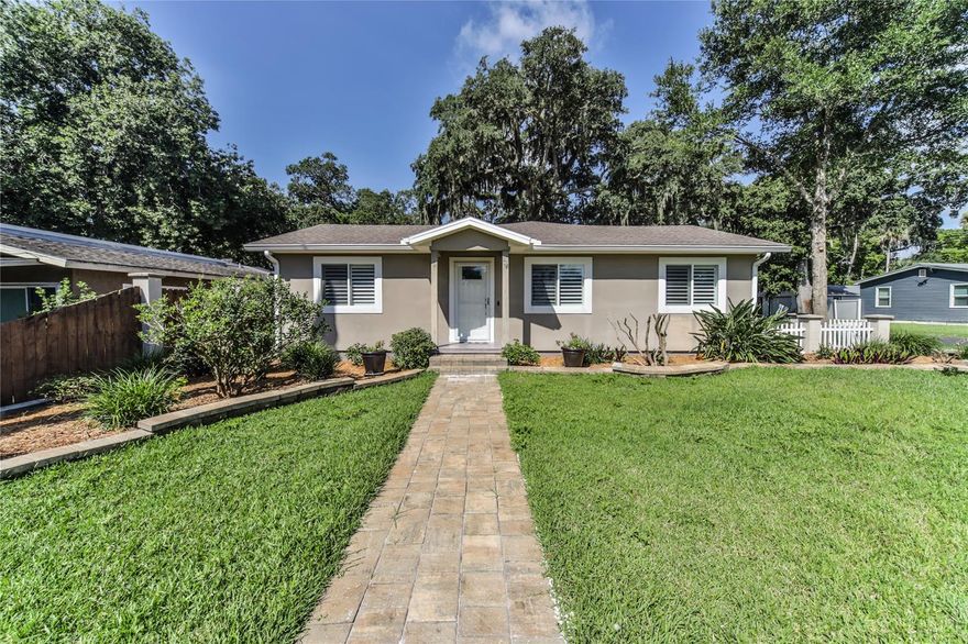 Welcome home!  This Beautiful fully furnished 2 bedroom 2 bath is conveniently located  in the New Smyrna Beach historical district. Situated on a LARGE lot, and walking distance to many great restaurants and shops! Custom built home with Dual pane windows. Wood entry floors, beautiful vaulted ceilings, a split floor plan and newer paint. Kitchen includes all you need! From brand new cookware to newer appliances, ceramic tile floors, breakfast bar, sparkling granite counters, recessed lighting and a ceiling fan making it a chefs delight! Ready to relax after a long day? No sweat! The  living room has cherry wood floors, ceiling fans and large comfy couches for you to rest.. Need some fresh air?  Open the French doors just off the living room and enjoy the beautiful Florida weather in your screened in porch with ceiling fans.  Master bedroom has a Queen size bed and walk in closet with an organizer with a private ensuite bathroom that offers a large walk in shower and corian vanity. The 2nd bedroom offers a king bed and your own private bathroom. Laundry room speaks volume with a sink and newer washer and dryer. This home is a must see!  Offering Month to month rental, or looking for long term? Lets talk!