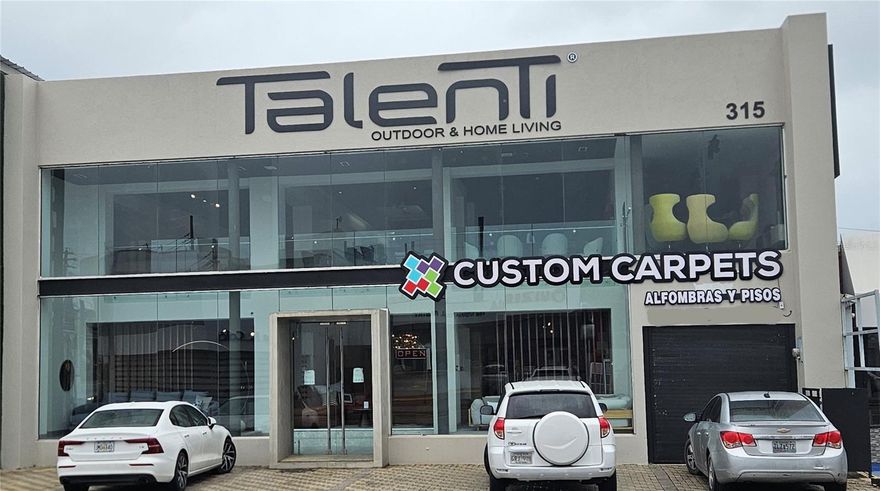 Remodeled modern 2 story showroom building on Roosevelt Ave 2 blocks from Plaza Las Americas. The first Floor has 2,860 sf of store space plus 772 sf of garage space, and the second floor has 3,074 sf of store space. Ideal for a boutique, furniture or lighting store. 6 parking spaces in front plus 3 in the garage that has a roll up door. Full frameless glass storefront. Next to Novo Stilo, McDonalds, Popeyes, and Suizeria.