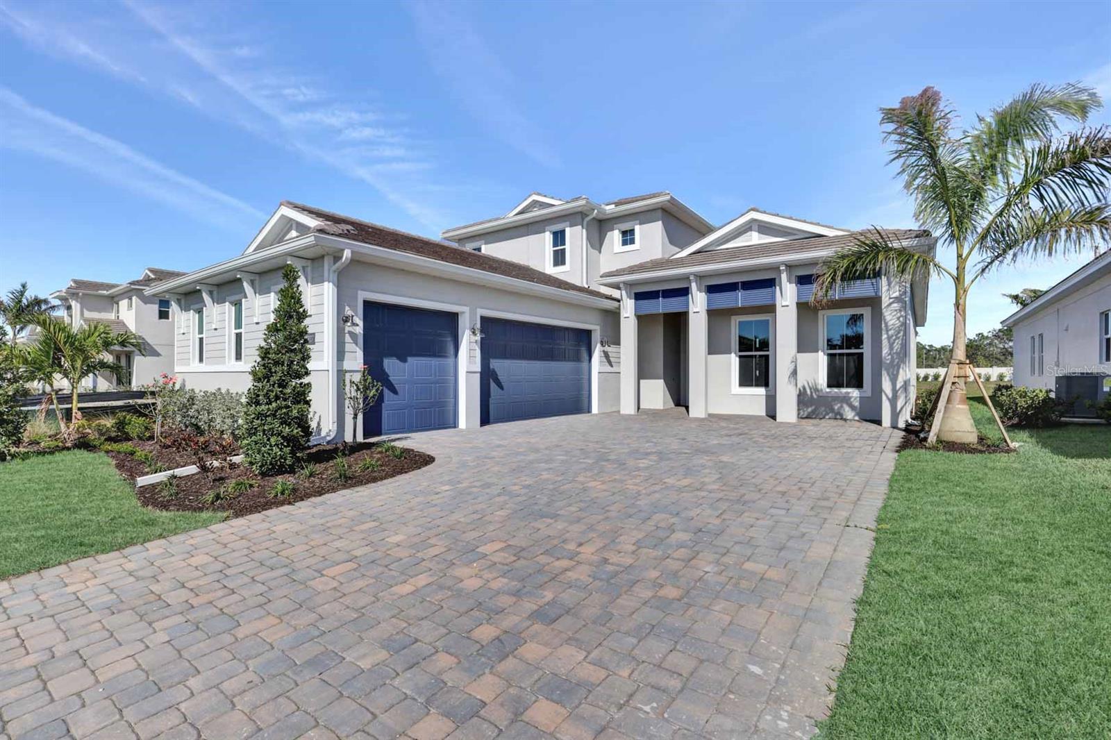 Under Construction. The Avery Elite Antilles home offers 3,184 sq. ft. of luxurious living. Enjoy your spacious east facing lanai with gorgeous water views, where you can relax in privacy. The outdoor living space is complemented by a luxurious outdoor kitchen, ready and waiting for you to grill and entertain. Experience seamless indoor-outdoor living with 10 foot, 90 degree stacking sliders, that open your kitchen, great room, and casual dining area to the lanai. A light and bright chef's dream kitchen with a vibrant backsplash features Kitchenaid appliances, ample storage, and a walk-in pantry. The primary bedroom suite has a spa-like feel, with dual vanities, a large closet, and a freestanding tub inside the wet room style shower. Both secondary bedrooms feature their own ensuite baths, in addition to a convenient powder bath on the first floor and an additional full bath in the upstairs loft. The expansive loft provides endless potential, ready to suit your needs. The home also offers a spacious laundry and a 3 car sideload garage. Filled with designer upgrades, including engineered hardwood flooring throughout, upgraded cabinets, countertops, appliances, and more.
