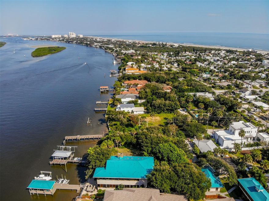 A RARE FIND..........DIRECT INTRACOASTAL NORTH BEACH  115 FT FRONTAGE SITE LOCATED ON THE MAIN CHANNEL OF THE INDIAN  RIVER.  HIGH ELEVATION LARGE LOT ALLOWS PANORAMIC VIEWS OF THE RIVER,  BREATH TAKING SUNSETS,  & THE EVER CHANGING VISTAS OF THE RIVER ACTIVITIES OF BOATS, DOLPHINS & BIRDS. LAUNCH YOUR BOAT FROM YOUR PRIVATE DOCK & DRIVE  TO PONCE INLET WITHIN MINUTES , THE ATLANTIC OCEAN & THE WATERS  BEYOND!   NEWLY CONSTRUCTED DOCK HAS AN  80 FT WALKOUT,  A 12 FT WIDE PLATFORM, & STEP DOWN  LOADING PLATFORM. YOU HAVE  SPACE FOR 3 BOATS PLUS YOUR WATER TOYS!  THERE IS A
50 FT  OPEN ELECTRIC BOAT LIFT,  A  25 FT COVERED ELECTRIC   BOAT LIFT,  ONE OPEN WET  SLIP ON THE SOUTH SIDE OF THE DOCK,  & A FLOATING PLATFORM FOR 2 JET SKIS OR WAVE RUNNERS. THE LOT HAS A ROCK REVENTMENT AND SEA WALL.
  A HIDDEN GEM WITH AN OLD FLORIDA ATMOSPHERE HAVING LARGE OAKS & PALMS TREES THAT  OFFER SECLUSION YET WITHIN WALKING DISTANCE TO  OUR BEAUTIFUL OCEAN, FLAGLER AV EVENTS, SHOPPING,  RESTAURANTS  & A PERSONAL BOATING EXPERIENCE TO EVERYWHERE!; Cleared: Partial ;Water: City