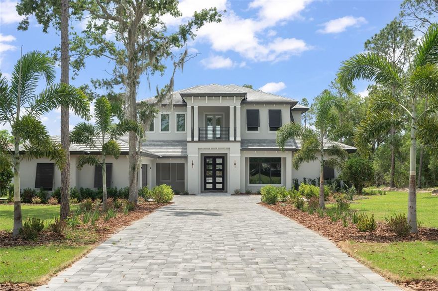 Experience the pinnacle of luxury in this exquisitely crafted home, showcasing an array of premium features throughout. The gourmet kitchen is a culinary masterpiece, equipped with Fisher & Paykel appliances, including an 8-burner gas range with a hood and pot filler. Two expansive islands, including a stunning quartz waterfall island with seating, seamlessly transition into the open-concept Great Room with a coffered ceiling. Two sets of 12-foot pocket sliding glass doors extend your living space to the expansive outdoor lanai, featuring multiple seating areas, a fully-equipped summer kitchen, and a breathtaking pool and spa oasis, perfect for entertaining.

The first-floor primary suite is a tranquil retreat, boasting his and hers walk-in closets, dual vanities, a luxurious shower, and a soaking tub. A private guest suite off the kitchen features an en suite bath, built-in closet, and French doors opening to the backyard. An oversized office on the main level provides a perfect workspace for those working from home. The functional mudroom and spacious laundry room include a dog wash station, utility sink, and ample storage.

Upstairs, three generously sized bedrooms each have oversized closets and en suite bathrooms. At the top of the staircase, double doors lead to a charming covered balcony overlooking the front entry. The enclosed loft, accented with French doors, opens to a large covered balcony that overlooks the pool area, providing a serene space for relaxation or entertaining. This home exemplifies luxury living with impeccable attention to detail and a seamless blend of indoor and outdoor spaces.

Bella Collina offers an unparalleled lifestyle with world-class amenities, including a Sir Nick Faldo-designed 18-hole golf course, a resort-style pool complex, a state-of-the-art fitness center with 20 complimentary classes each week, Har-Tru tennis courts, and pickleball facilities. Enjoy multiple dining options with both indoor and patio seating, a full-service spa, and a vibrant calendar of year-round social and culinary events for all ages. This meticulously maintained estate is truly one-of-a-kind and must be seen to be fully appreciated. Schedule your private tour of this exceptional home and experience the Club at Bella Collina. Call today to book your exclusive showing. Deferral of the $40,000 Sports Membership Deposit is included by the Developer.