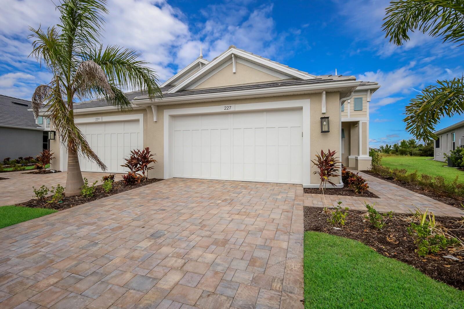 This stunning new Boca Grande villa built by Medallion Home is located just minutes from Lakewood Ranch and I75. Luxurious details throughout this 2 bed, 2 bath + den home include a beautiful Gourmet kitchen featuring stunning Quartz counters, built in double oven and gas cooktop. Relax and unwind on your peaceful extended, paver lanai with pond view. Watercolor Place is a low maintenance, gated community that offers tile roofs, brick paver driveways on all homes as well as a community pool. Upgrades include: impact windows, tankless water heater, 5 1/4 baseboards and more! NO CDDs in Watercolor Place.