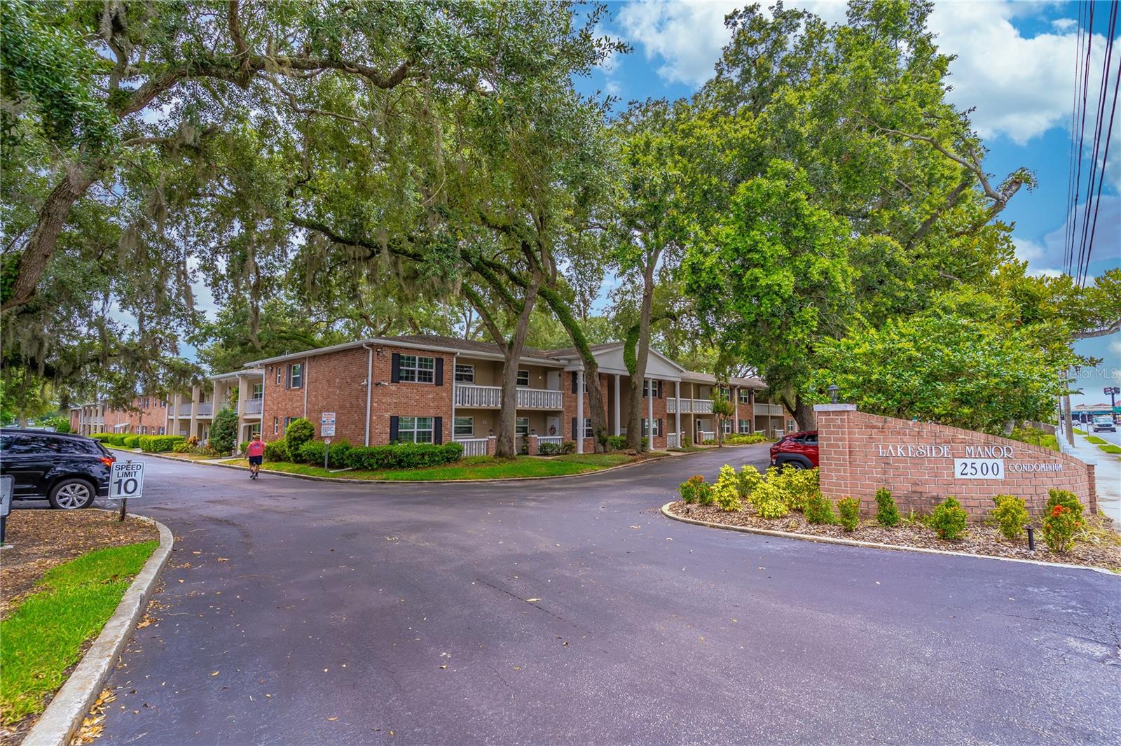 Reasons you'll love this condo: convenient, cozy and quiet, you can't beat this community for its location and tranquil setting on Lake Killarney. Add to that the brand new air conditioning system (2025), hot water heater (2025) and fresh paint throughout (2025) and you'll see why this unit is for you. Step into the unit through the brand new front door (2025) and you are in the generous living room with dining space. The tidy kitchen with matching all white appliances is clean as a whistle. You'll love the large utility is where you'll find the air conditioner, hot water heater and plenty of shelving. The bathroom has new vanity (2025), mirror and light fixture (2025), and newer toilet. You'll find the bedroom spacious with a large double closet. Ceiling fans in living and bedroom. Location in the community is handy, with assigned parking space just steps away and easy access to the quiet courtyard. You'll love the lakefront outdoor space including pool, club house, tons of manicured green space, over-water covered seating on the new dock, boat launch and slips. Close to shopping and dining in Winter Park, easy access to highways. This community is everything people come to Florida to find!