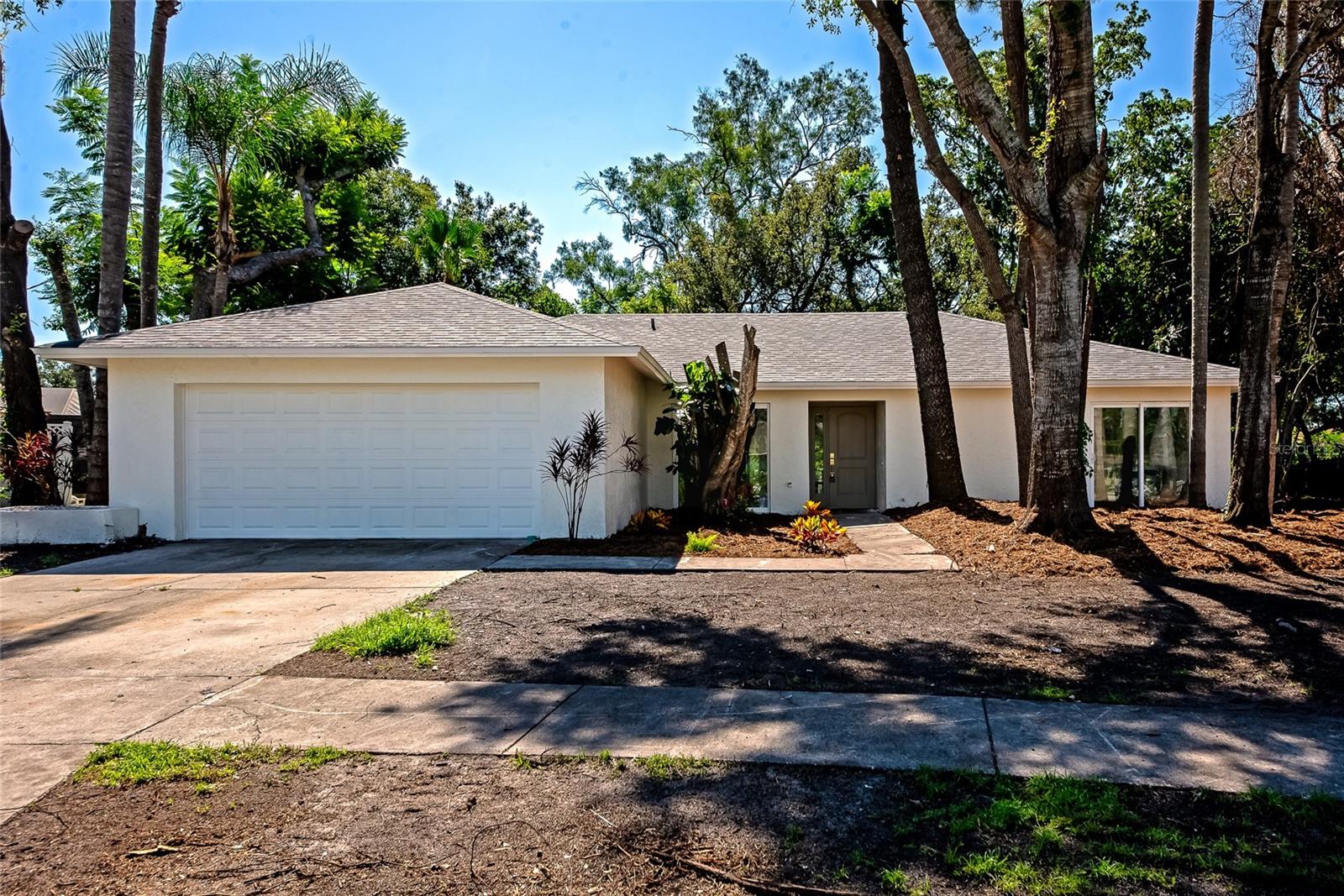 Welcome to 1862 Orangewood Lane, a charming residence tucked away in the desirable Tamaron community of Sarasota. This spacious home offers the perfect blend of comfort, convenience, and Florida living. Featuring 4 bedrooms and 2.5 bathrooms, the property boasts an open and inviting floor plan with abundant natural light. The living and dining areas flow seamlessly, creating the ideal space for both everyday living and entertaining. The kitchen is well-appointed with: stainless steel appliances, quartz countertops, custom cabinetry and more! Step outside to your private backyard oasis, where mature landscaping and a peaceful setting make it the perfect spot to enjoy your morning coffee or relax in the evenings. Located just minutes from Sarasota’s vibrant downtown, renowned beaches, shopping, dining, and cultural attractions, this home places you at the heart of it all while still offering the tranquility of a quiet neighborhood. Enjoy the best of Sarasota living as a full-time residence, seasonal getaway, or an investment property.