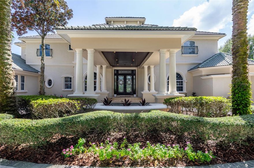 One or more photo(s) has been virtually staged. Luxurious waterfront estate nestled within the gated community of Keystone Shores. This custom-built, 5-bedroom, 6.5-bathroom masterpiece was crafted by Fernandez Luxury Homes for commercial legend Billy Mays boasting an array of stunning features and upgrades integrating high-end design with lakefront living and entertaining.
 
You'll be captivated by the awe-inspiring front featuring a graceful porte cochere, fountain, and beautifully landscaped grounds. The home enters to an impressive grand foyer, showcasing a 24-foot ceiling, crystal chandelier, gas fireplace adorned with artistic stonework, and wrought iron staircase spiraling to a cozy loft with bookshelves. Breathtaking water views can be enjoyed throughout from the large double-pane, hurricane proof, tinted windows.
 
The custom kitchen is complete with a large island, oak cabinetry, walk-in pantry, top-of-the-line appliances, and a breakfast bar. Elements such as the walk-in wine cellar, fully functional bar and butler’s pantry make entertaining easy. The spacious family room features massive corner glass sliding doors that seamlessly extend the entertainment area outdoors. The first-floor master suite offers ample closet space, a garden tub, and a glass-enclosed rainforest shower looking over a private garden.
 
Other notable features include a state-of-the-art soundproof theater with its own bar, a game room with a pool table and impressive lake-front views, marble flooring, 8-foot solid wood doors throughout, and smart home technology with a hidden surround sound system both inside and out. Enjoy the heated pool with jacuzzi overlooking the serene lake or relax on the fishing dock under the private gazebo on calm lake waters.
 
Conveniently located just minutes from dining, shopping, and entertainment, and only 20-30 minutes from the airport, beaches, and downtown Tampa, this estate offers a quiet retreat in a secluded location. Don't miss this rare opportunity to own a piece of paradise. Room Feature: Linen Closet In Bath (Primary Bedroom).