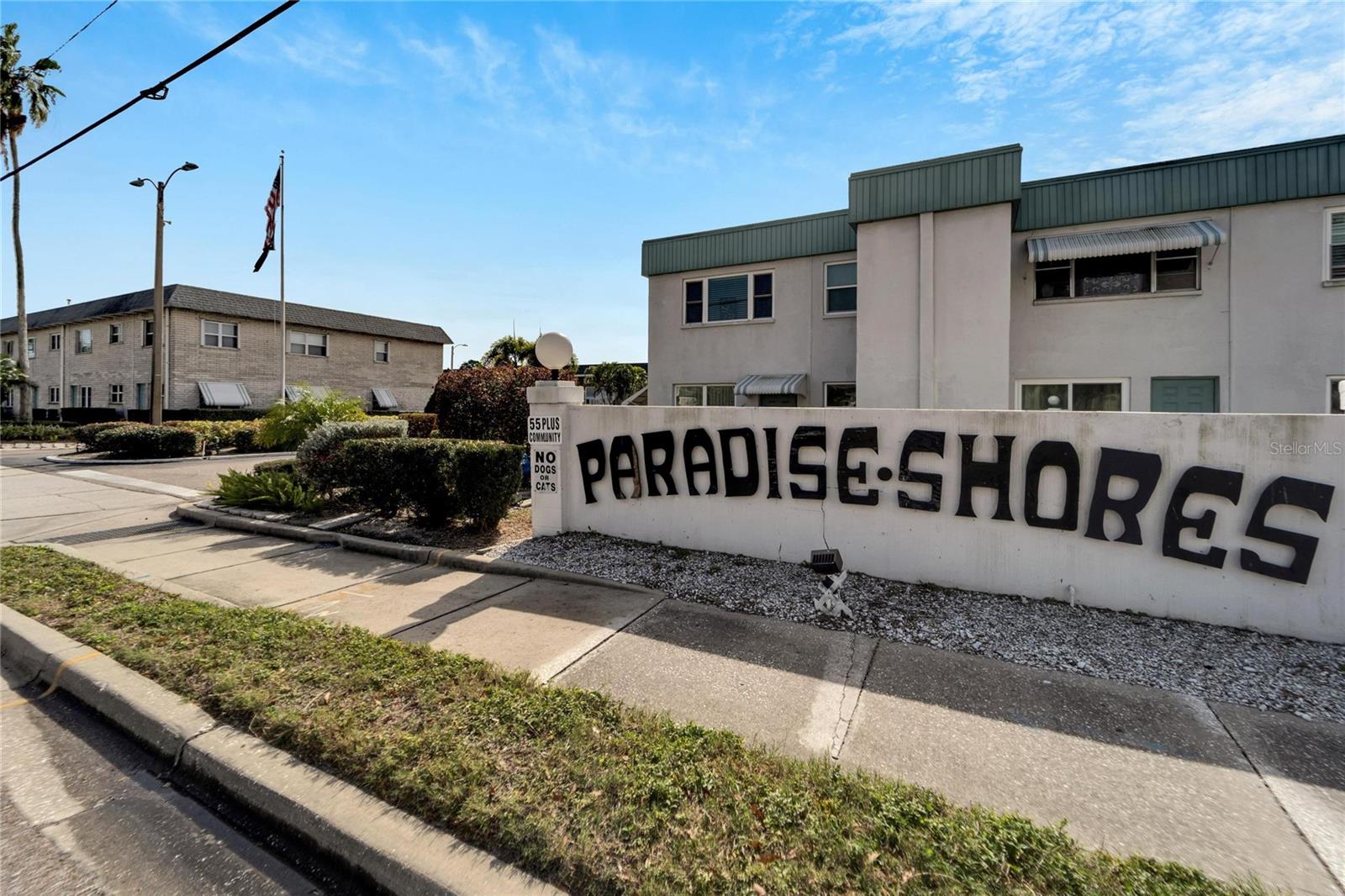 Welcome home to your piece of heaven in Paradise Shores! Centrally located in the heart of Pinellas County, this 1st floor condo is minutes away from shopping, medical facilities, beaches, and entertainment. As you enter the condo, you'll appreciate the open floor plan with living/dining room combo. The updated kitchen is just off the dining room. In here, you'll find custom cabinets that maximize space and utility, gorgeous quartz countertops with a food prep area, and updated sink with full-size dishwasher. With glass doors and windows on both ends of the living room, there's no lack of natural light here. The bedrooms are split for privacy. The second bedroom offers plenty of space and a reach-in closet, and the hall guest bath is just steps away. The hall bath countertops were recently refinished as was the bathtub itself. At 17'x12', the master bedroom is easily large enough for a full desk/home office in the corner. The ensuite master bath has similar updates to the hall bath, and both toilets were recently replaced as well. This bedroom also has a spacious walk-in closet. The A/C - furnace was replaced within the last few years. The monthly HOA fee includes water, sewer, trash, cable tv, high-speed internet, gas (for the stove, water heater, and furnace), maintenance of the pool and grounds, and insurance. The community organizes many fun events for those who wish to participate in a more active lifestyle. There is also a heated community pool, covered bbq area, huge shuffleboard area, and bocce ball court. Schedule your showing and see this gem today!