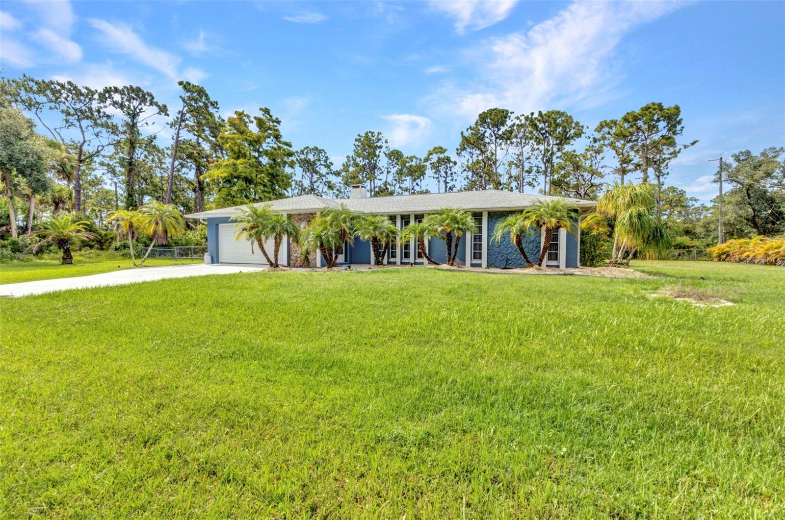SPACIOUS 4-bedroom, 3-bathroom, 2-car garage pool home situated on a double lot in Port Charlotte with no HOA fees. This beautifully maintained property offers a bright, open floor plan with tile and luxury vinyl flooring throughout, creating a warm and inviting atmosphere. Large windows fill the home with natural light, while the open living and dining areas provide the perfect space for hosting friends and family.
The kitchen is a chef’s delight with stainless steel appliances, granite countertops, a tray ceiling with fan, and plenty of cabinet space for storage. Just off the kitchen, the cozy family room features a wood-burning fireplace and sliding glass doors that lead to the lanai, seamlessly expanding your living and entertaining space.
The master suite offers dual closets and a private ensuite bath with a single-sink vanity and a fully tiled walk-in shower. Guest bedrooms are located on a split floor plan for added privacy, with a shared bathroom nearby. A large covered lanai includes a convenient full pool bath and is the perfect spot to enjoy your morning coffee or unwind in the evening. Step outside to the sparkling private pool or soak up the Florida sunshine from the pool deck. The fully fenced backyard offers a pebble patio ideal for summer cookouts along with a storage shed for all your lawn and gardening needs.
Recent updates include a new roof in 2021, pool pump and chlorinator in 2023, exterior paint in 2024, new curbing and landscaping with fruit trees in 2024, updated bedroom flooring in 2023, refreshed bathroom fixtures in 2023, and modern ceiling fans.
Conveniently located near I-75, US-41, and 776, this home provides easy access to Cocoplum Shopping Center, Port Charlotte Mall, a variety of restaurants, grocery stores, and retail shops. Award-winning beaches are just a short drive away, making this the perfect location to enjoy the Florida lifestyle. Schedule your private showing today.