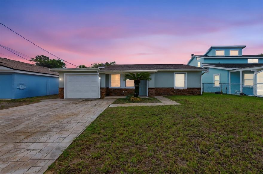 One or more photo(s) has been virtually staged. Experience the charm of true beachside living in this inviting coastal retreat, ideally located just approximately 1.5 blocks from the Atlantic Ocean and moments from the Intracoastal Waterway. Offering a relaxed lifestyle with both sunrise beach walks and peaceful riverfront views nearby, this location captures the essence of Florida coastal living.

This 2-bedroom, 2-bath home features a comfortable and versatile layout, including a spacious family room with a fireplace that creates a warm and welcoming atmosphere. The interior is complemented by wood flooring throughout the main living areas, along with an updated kitchen featuring granite countertops and stainless steel appliances.

An enclosed vinyl porch provides additional living space, perfect for enjoying year-round natural light or creating a flexible retreat for relaxation or entertaining. The property also includes a garage and ample parking, adding convenience to everyday living.

Situated in a desirable Daytona Beach beachside community with close proximity to local dining, shopping, and everyday amenities, this home offers an excellent opportunity for a primary residence or second home in a sought-after coastal setting.