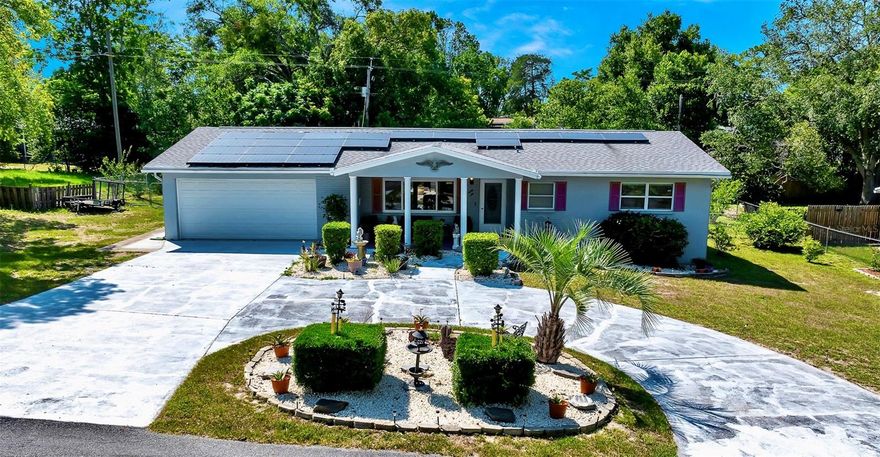 Located in the peaceful community of Beverly Hills, this charming 3-bedroom, 2-bathroom home features a two-car garage, solar panels for energy efficiency and 1,705 square feet of well-designed living space on a spacious 0.32-acre lot. Step inside to find a generously sized living room, perfect for relaxing or gathering with friends and family. The space flows seamlessly into an oversized kitchen that’s sure to impress—with an abundance of cabinetry, expansive counter space for meal prep, a walk-in pantry and breakfast nook.Primary suite offers a peaceful retreat complete with a walk-in closet and en-suite bathroom boasting a tile walk-in shower. One guest bedroom is located just across the hall close to the second bathroom, making it ideal for guests or a home office.  The third bedroom is located off the dining area and features its own private entrance to the outside—making it perfect for use as a mother-in-law suite or private guest quarters. Step out back to enjoy your morning coffee or unwind in the evenings on the screened-in porch, which overlooks the fully fenced backyard. The yard offers plenty of room for pets, gardening or entertaining, with the added security of a completely enclosed space. This home also features a New roof installed in 2021, HVAC system installed in 2019 and a 1-year warranty at closing giving the buyer added protection and peace of mind from day one. With its energy-efficient upgrades, spacious layout and outdoor living potential, this home checks every box for comfortable Florida living!