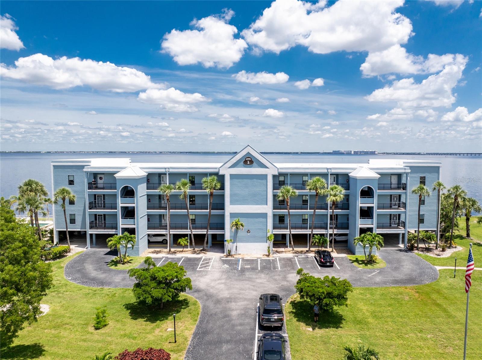 A back wall that will allow you to enjoy a breathtaking view of the harbor is just one stunning detail this home has to offer. This completely renovated, from wall to wall, 3/2 END UNIT condo, offers a third floor (top) view, with space to entertain, relax, and enjoy some of the most desired living that Punta Gorda Isles has to offer. Open your door to be welcomed by modern style living including high ceilings and a kitchen that has been beautifully designed to keep you engaged in all that is going on around you. These beautiful counter tops offer ample, usable space, with cabinets that provide an abundance of storage. The primary bedroom is set apart from the other two rooms and is situated within that bird's eye view of the water. Both bathrooms offer updated spacious areas with modern showers and vanities. The 2nd and 3rd bedrooms are located on the opposite end of the home, given privacy where needed. The extended space off the living room provides room for an office or just an area under air where you can take advantage of the view. With ownership you can enjoy assigned under building parking for one car, plenty of extra building front parking spots, pool, tennis court, clubhouse, and your own storage unit. The elevator offers service to your top floor so walking stairs can be a choice, not a concern. Conveniently located near downtown Punta Gorda, Fisherman's Village, and I-75, this home belongs on your must see list. Schedule today and start enjoying your slice of paradise.
