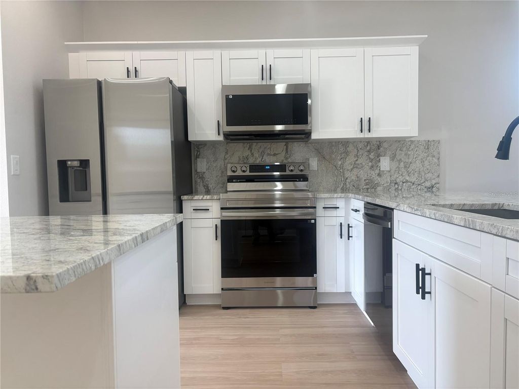 Photo of 1305 E Parker Avenue, Lakeland, FL 33805 (MLS # TB8424387)