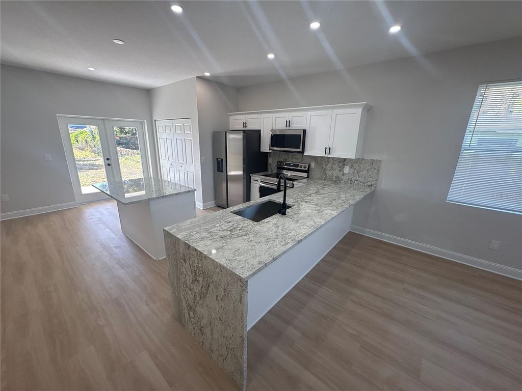 Photo of 1305 E Parker Avenue, Lakeland, FL 33805 (MLS # TB8424387)