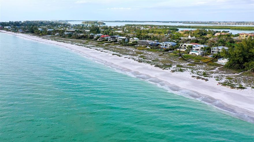 Magnificent Gulf front estate beauty with privacy gates opening to reveal this gorgeous home!! Completed in 2017, this luxurious home is the pinnacle of coastal living.  The gated Key West style estate is casually elegant with emphasis on the breathtaking expansive views of the Gulf waters, beach and vibrant sunset views. Outstanding vistas are enhanced from the main living area through large floor to ceiling sliding pocket doors that open to the lanai expanding the living space and taking full advantage of beachfront living and the above ground pool and spa. The pool terrace has expansive sitting areas with a fire pit and barbecue grill. The focal point of the main living area is the brick fireplace and large T.V. above.  The floorpan is totally open to the kitchen and includes an island sitting area by the kitchen with granite countertops and high end appliances. The two en suite guest bedrooms are also on the first living level and have views of the beach. There is also a custom full size laundry room on the first floor. The open stairway leads to the totally private master suite retreat that encompasses the entire third floor. The spacious master suite bath includes a elegant shower, tub plus duel vanities with outstanding exquisite finishes. Sliding glass doors open to a large sensational third floor lanai. A three car garage is sure to please the car enthusiast plus there is ample storage space. This gated estate is located on the most beautiful walking beach plus offers extraordinary privacy. The location is a short distance away from the shopping and dining on St Armands Circle and Anna Maria. Longboat Key Club is also minutes away with golf, tennis, pickleball and other club amenities.