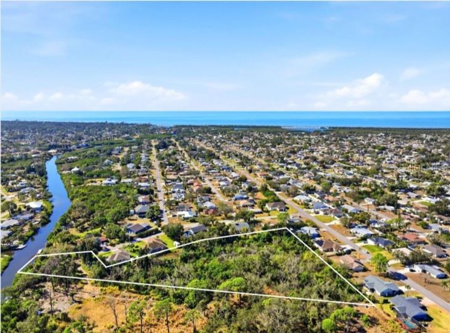 Rare waterfront acreage opportunity in South Venice. This 2.66-acre parcel on Alligator Creek offers a unique combination of size, location, and zoning in an area where large buildable lots are increasingly limited. Zoned RSF-3, the property allows for single-family residential development with flexibility for a variety of future uses, subject to county approvals. The property is well suited for a private waterfront estate, with ample room for a custom home, pool, guest accommodations, and outdoor living spaces, or for the development of multiple single-family homes consistent with zoning. Its generous size and irregular configuration provide opportunities for thoughtful site planning while maintaining privacy and a natural setting. With direct frontage on Alligator Creek, the property offers a peaceful, scenic environment ideal for kayaking, canoeing, fishing, and enjoying Florida wildlife. Mature vegetation enhances the sense of seclusion, yet the location remains convenient to U.S. 41, area beaches, shopping, dining, and all the benefits of Venice. Whether intended for personal use, development, or long-term investment, this property represents a rare chance to secure waterfront acreage with zoning flexibility in a desirable and established area of South Venice.