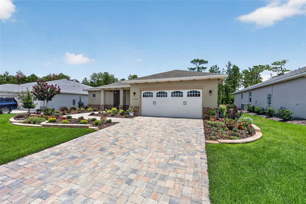 Photo of 10724 SW 101st Loop, Ocala, FL 34481 (MLS # OM728189)