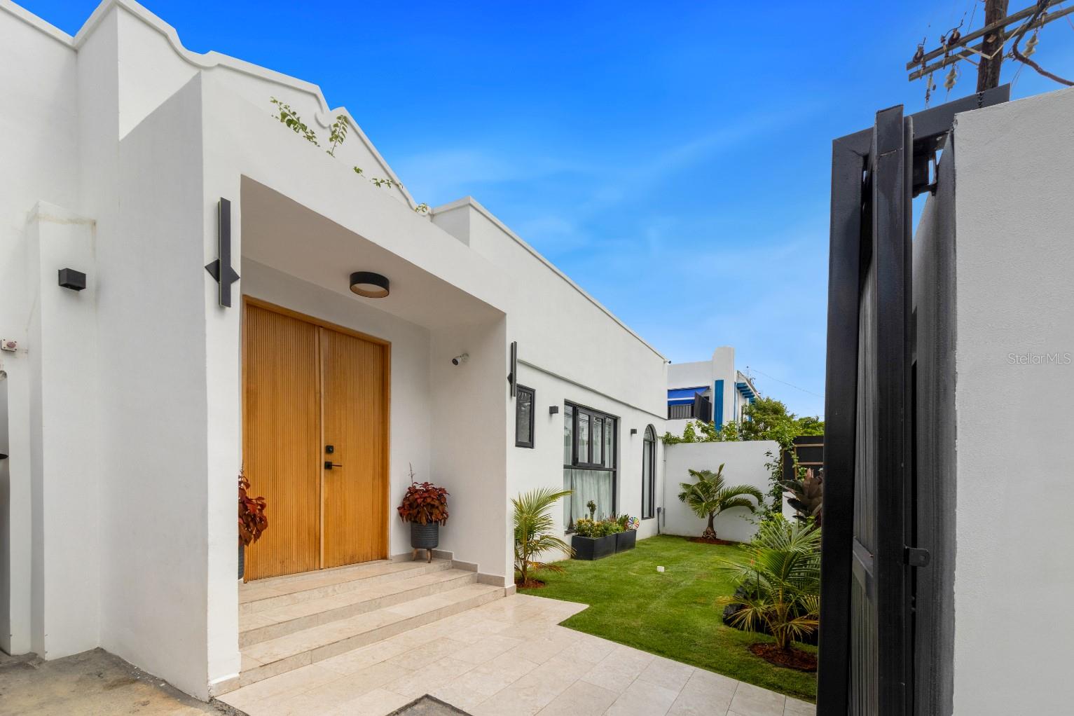 Refined Urban Living in San Juan’s Coveted Condado Neighborhood.
Embark on a journey of refined urban living in the vibrant heart of Condado. This 3,374 sq. ft. residence, set on a 560 sqm lot, offers unparalleled comfort and convenience, with an expansive 1,800 sq. ft. outdoor terrace.
Step into this light-filled home with soaring ceilings and skylights. The grand room features spacious living and dining areas, a gourmet kitchen with adjoining family room, and three bedrooms, each with an ensuite bath. Solar panels with battery storage provide modern efficiency.
A stunning one-bedroom casita or in-law suite, complete with kitchenette and floor-to-ceiling glass, seamlessly blends indoor and outdoor living. Outside, the private oasis boasts a sparkling saltwater pool, spacious terrace, wet bar, and grill, perfect for entertaining or relaxing in total privacy.
Enjoy a vibrant neighborhood within walking distance to St. John’s and Robinson Schools, fine dining, boutique shopping, parks, pristine beaches, and medical facilities. This sought-after property harmonizes cosmopolitan allure with coastal tranquility.