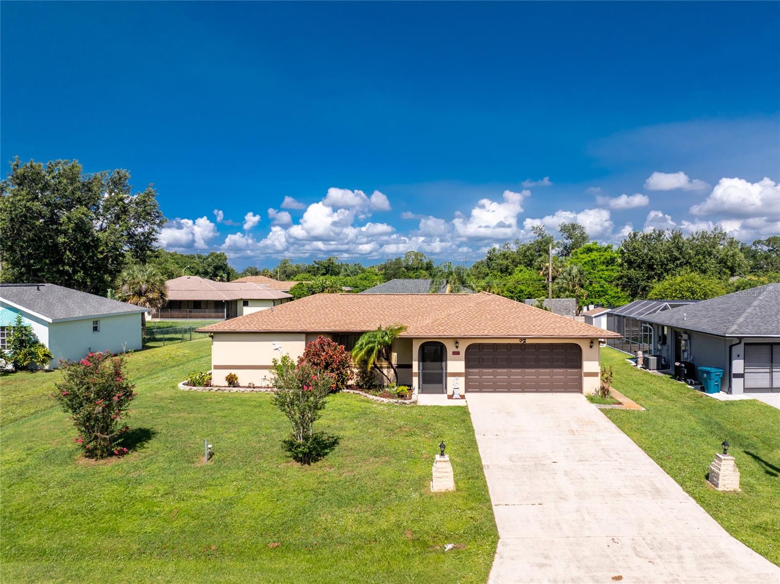 Welcome to your dream home in Port Charlotte, Florida! Step into the inviting living room, where you'll find a modern built-in TV and an electric wood-burning look fireplace, perfect for cozy winter evenings. The kitchen was remodeled in 2025 and is a chef's delight, featuring brand-new cabinets, countertops, appliances, and a stylish barn door that adds a touch of rustic elegance. This charming 2-bedroom house boasts a bonus room that can be tailored to your needs, whether it be a den, home office, playroom, or guest space. In the garage, there are lots of cabinets for storage. Outside, you'll discover two spacious storage buildings, providing ample space for all your belongings. This home is a perfect blend of comfort and style, ready for you to move in a make it your own. Don't miss out on this fantastic opportunity to live in one of Florida's most desirable locations that is convenient for shopping and schools. Schedule today to see this home.