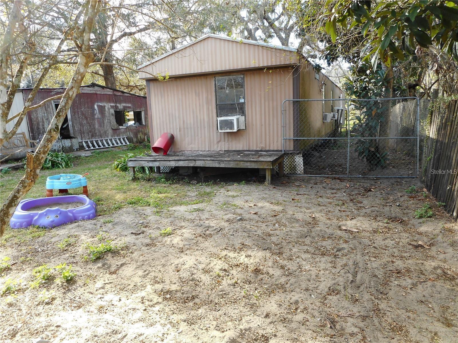 INVESTORS !!! INVESTORS !!! TWO INCOME PROPERTIS !!!ONE OF THE UNITS IS MANUFACTURE HOME HAS 3 BEDROOMS 2 /1 BATHROOM 924 SFT THE OTHER ONE IS AN PROPOERTY WITH 5 BEDROOMS 2/1 BATHROOM 1,164 SFT JUST WESTS OF HWY 547 N TO DAVENPORT EXTRA LARGE LOT. TWO UNITS ARE OCCUPIED MONTH TO MONTH CLOSE CHAMPIONS GATE RESTAURANTS, SHOPS ,PARKS .