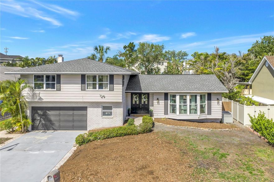 Tucked away in the established Whispering Pines neighborhood of unincorporated Seminole, just a quick 5-minute drive to Indian Rocks Beach, this beautifully refreshed split-level Florida ranch invites you in with space, flexibility, and endless opportunity to make it your own. Step inside and you’re immediately welcomed into a layout designed for gathering. The main level offers multiple living and entertaining spaces that flow effortlessly together, including a spacious downstairs retreat that opens directly out to the pool—perfect for hosting, relaxing, or creating your ideal indoor-outdoor lifestyle. Just off the kitchen, a versatile bonus space gives you options for a formal dining room, home office, or game room—whatever fits your season of life. Upstairs, all four bedrooms are thoughtfully tucked away, creating a private retreat from the main living areas. The oversized primary suite overlooks the pool and backyard and features its own en-suite bath, while three additional generously sized bedrooms and a full bathroom provide plenty of space for family or guests. Out back is where the vision really comes to life. The pool has been completely refreshed with a new pebble finish and light (2026), and the lot itself has been cleared—offering a true blank slate to design your dream outdoor space. Whether it’s a putting green, pickleball court, fire pit lounge, or an expansive entertaining area, this backyard is ready to become whatever you imagine. Thoughtful improvements bring peace of mind, including a brand-new roof (2026) and over $10,000 in tree removal to open up the property and maximize usability. Located in an AE flood zone, the home experienced minor water intrusion during recent storms, with all affected drywall, flooring, and baseboards professionally remediated and restored. Currently operating as a successful Airbnb, this home offers flexibility for those looking to invest, settle in full-time, or enjoy the best of both worlds. Complete with a 2-car garage and just minutes from the beach, dining, and shopping, this is a property that truly adapts to your lifestyle. Spend your mornings at the beach, your afternoons by the pool, and your evenings creating the kind of space you’ve always envisioned—this is Florida living with room to grow.