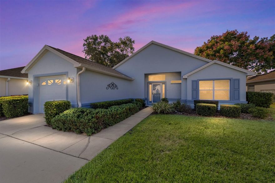 This rare Ocala model on a fully maintained lot lets you spend more time doing what you love. Located less than 1 mile from the Royal Oaks Golf Club and the Palm Grove Clubhouse, it is just a short golf cart ride to golf, swimming, a fitness center, and events like dancing, bingo and more. And you can ride down to the Orchid Club with so many more activities, as well as tennis and pickleball.  This open concept, split plan with high ceilings is light and bright in every room! The spacious kitchen has a bar and opens to the living area, which is great for entertaining. The breakfast nook features a window overlooking the beautiful landscaping. And you can step right outside to the screened in patio where you can relax with a morning coffee and watch the birds begin their day. The spacious primary bathroom includes a double sink vanity and a step in shower with a built in shower bench.  On the other side of your home is the guest bedroom, and bathroom with a granite countertop.  A retractable garage screen door allows you to tinker in privacy with a breeze and natural light, and notice the double driveway with room for parking. 
Block construction with recent exterior paint, new roof in 2021 with a 50-year shingle manufacturer's warranty, and new AC in 2014. With all of this AND a community restaurant, this home offers the perfect balance of convenience and leisure. Embrace a low-maintenance lifestyle with easy access to all of the community’s best amenities.  Your fully maintained lot includes regular mowing, irrigation, mulching, and pest control. Service fees include garbage and yard waste collection service, 24-hour security service, basic cable service, and use of all recreational facilities (except for the golf course).  The property information provided is deemed to be true and correct, however, Keller Williams Realty Inc., nor its agents, guarantee the accuracy of the information. One photo is virtually staged.