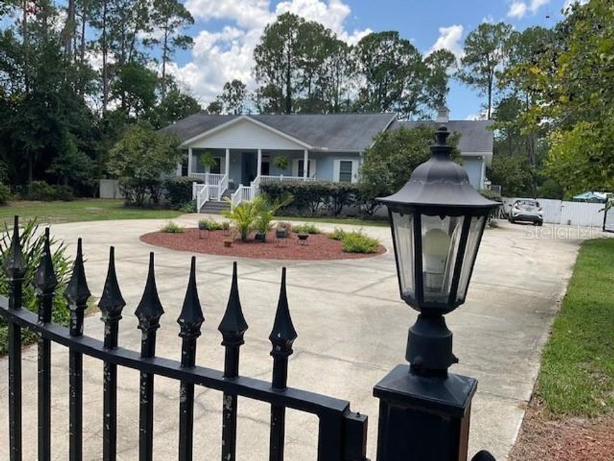 This Is the Home You've Been Waiting For! Welcome to your private oasis a stunning gated home that offers everything you need for luxury living and peaceful relaxation. Enjoy your own heated swimming pool with a waterfall, a full rear deck overlooking lush landscaping, and even lake views. This beautifully designed property features: Three spacious bedrooms, each with a private en-suite bathroom A gourmet kitchen with SS appliances, granite countertops, Cherry cabinets and elegant finishes Open-concept living spaces, perfect for entertaining or unwinding *A cozy sitting area and a dedicated home office *Voluntary POA *Exterior parking for your boat or RV * Irrigation system *Handicap accessible design with wide doorways and a garage lift already installed Whether you're relaxing by the pool, enjoying the view, or hosting family and friends, this home has it all, privacy, luxury, and comfort Don't wait to see this one!

Property Features - Approx. 3,806 Sq Ft Under Roof
Kitchen & Interior Features
" Stainless steel refrigerator, cooktop, and dishwasher (all less than 1 year old)
" Built-in microwave, oven with warming/proofing drawer
" Butler's pantry, updated cabinetry, deep sink, disposal, and abundant storage
" Remodeled master bedroom with luxury finishes
" Spa-like master bathroom: Jacuzzi corner tub with air/water jets, lights, and heater
" His and her sinks with extensive cabinetry
" Oversized walk-in shower with dual showerheads
" Walk-in closets in all bedrooms
" Updated light fixtures throughout
" New bathroom fixtures in all bathrooms

Accessibility & Garage
" Oversized 2-car garage with wheelchair lift and utility sink
" Almost every door is handicap accessible

Mechanical & System Updates
" New HVAC system (2024)
" Culligan water softener
" ADT security system
" Heat pump
" Attic storage
" Two garage door remotes

Outdoor Features
" In-ground pool with waterfall (approx. 17' x 27') - new liner (2025)
" Covered back porch (approx. 9' x 27') and covered front porch, composite
" Pergola for shaded outdoor living
" Mature landscaping with fenced front and backyard
" Concrete circular driveway
" Lake access through backyard
" Outbuilding/shed/workshop with power
*. Large flex room that can be a fourth bedroom