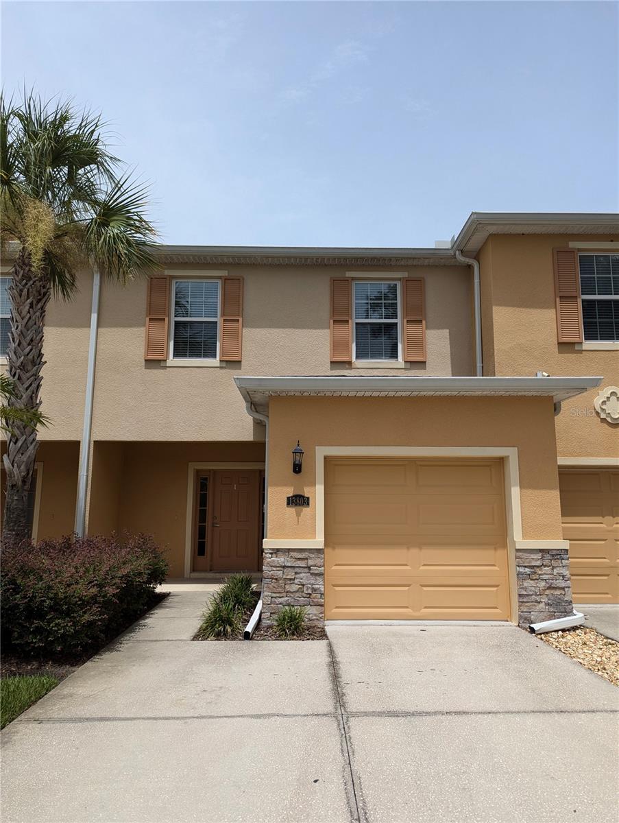 Welcome home! This beautiful townhome is located in the beautiful tucked away alcove known as Hidden River Townhomes, just minutes away from the University of South Florida, the Tampa International Airport, and I-75 and downtown Tampa. This pristine townhome features upgrades in every corner of the home, featuring high end finishes, stainless steel appliances, granite countertops, brand new flooring upstairs, and the most amazing view of your own private creek out back, the perfect place to read, drink your coffee and recharge. Upstairs, the three bedrooms are freshly painted, and the owner's suite features an en-suite bath and walk in closet. Don't wait!