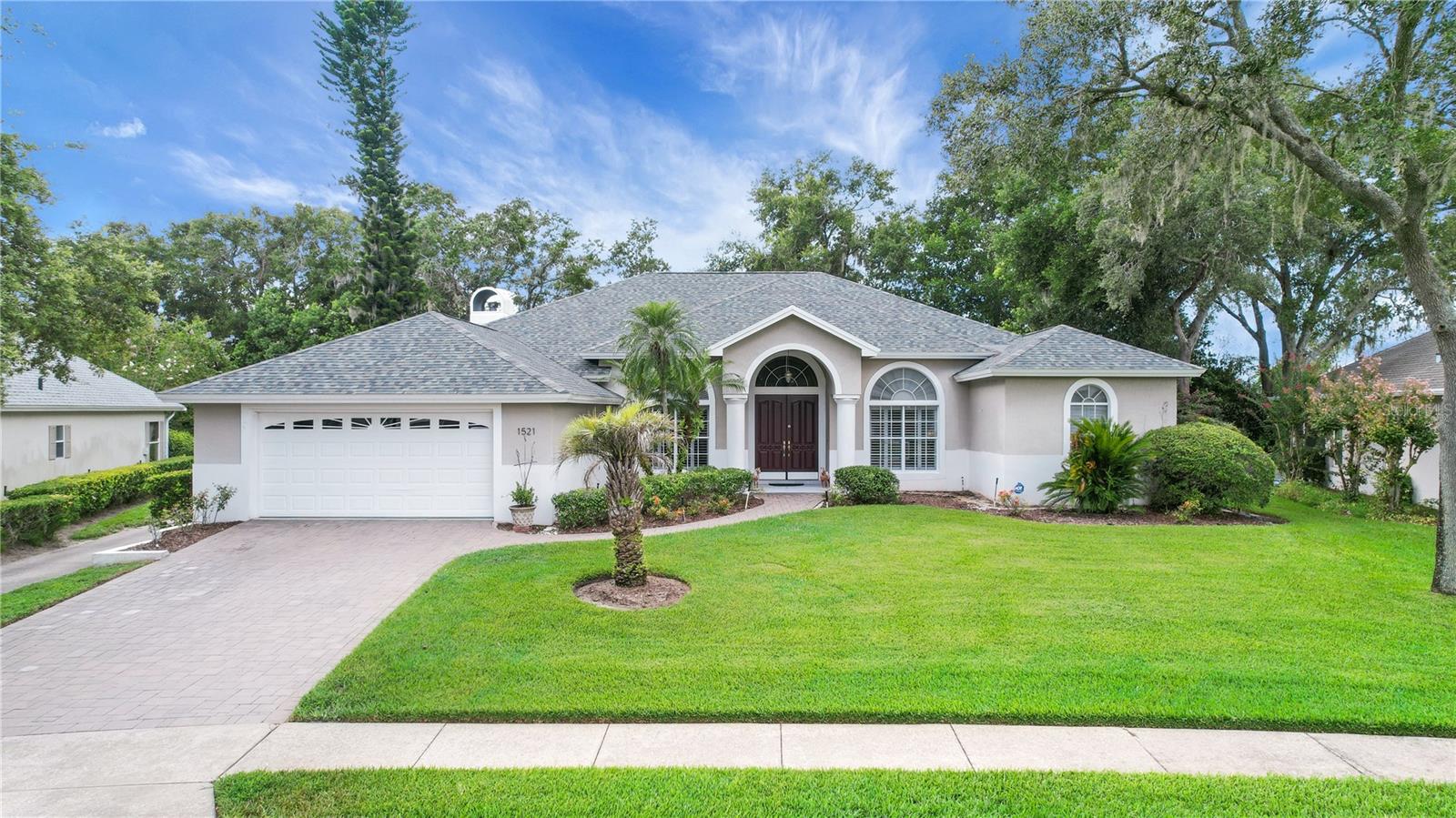 Stunning Golf Course Home with Resort-Style Living in The Country Club of Mount Dora
Exceptional Entertaining Spaces, Two Primary Suites, and a Spectacular Pool Retreat - This exquisite residence in The Country Club of Mount Dora, perfectly situated on a unique lot offering both golf course frontage and exceptional privacy for your lanai and pool area, thanks to lush greenspace directly behind the home. This property delivers an unparalleled setting for relaxation and entertaining, just minutes from charming downtown Mount Dora and only 40 minutes from Orlando. Step inside through the spacious foyer, where you are greeted by elegant formal dining and living areas. The living room features expansive views of the impressive pool, creating a serene backdrop and a perfect showcase for your favorite furnishings. The dining room, enhanced with beautiful chair railing, provides an inviting space for memorable gatherings with family and friends. At the heart of the home, the kitchen is designed for both culinary creativity and social engagement, boasting double ovens, a large cooktop, a center island, and abundant workspace. Open to both the breakfast area and family room, this light-filled space ensures you’re always part of the conversation, whether hosting a crowd or enjoying an intimate meal. The family room offers panoramic views of the golf course, while the breakfast nook overlooks the sparkling pool—everyday moments are elevated by the scenic surroundings. A dedicated study with double French doors is conveniently located off the foyer, ideal for a home office, reading retreat, or quiet work space. The study was originally designed as the third bedroom and could easily be converted back. Nearby, a full pool bath adds comfort and accessibility, especially for guests enjoying the outdoor amenities. The thoughtfully designed split plan offers two expansive primary suites, each positioned for maximum privacy. The main suite features a generous walk-in closet, spacious linen storage, dual vanities, a private water closet, and a luxurious garden tub with separate shower. The secondary suite also includes a large walk-in closet, roomy vanity, and a tub/shower combination—perfect for guests or multi-generational living. Practicality meets style in the well-appointed laundry room, complete with upper and lower cabinetry and a utility sink to make household tasks a breeze. Step outside to discover a true resort-style escape. The 30’ x 10’ pool with a stunning waterfall is the centerpiece of the 30’ x 36’ lanai, complemented by an additional 1,692 square feet of screened space for outdoor dining or lounging. There is ample room between the waterfall and rear screen enclosure for extra seating, ensuring every gathering is a memorable experience. Additional highlights include Plantation Shutters throughout, a roof replaced just 3 years ago, 7-year-old HVAC, and hurricane shutters for the entire rear of the home—providing peace of mind and lasting value. Enjoy the unique lifestyle of The Country Club of Mount Dora, with easy access to vibrant local shops, dining, the Atlantic Coast beaches just an hour away, and world-renowned Orlando theme parks nearby. This exceptional home invites you to relax, rejuvenate, and entertain with ease. Experience the perfect blend of comfort, elegance, and Florida living—schedule your private tour today!