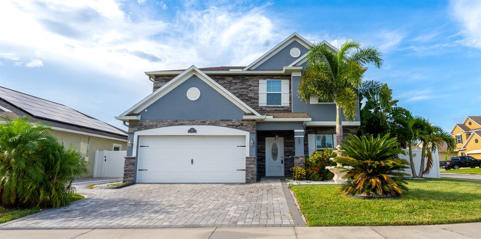 One or more photo(s) has been virtually staged. Welcome to Your Luxury Florida Dream Home!
This stunning residence is a rare opportunity to experience the ultimate in Florida living — complete with your very own private basketball court. Perfectly situated on a beautifully landscaped corner lot, this 3-bedroom + Loft, 2.5-bath home radiates curb appeal with PAVER DRIVEWAY, LUSH LANDSCAPING & WATER FOUNTAIN higlighting the stonework accented home. The light-filled floor plan showcases elegant CROWN MOLDING, STYLISH ACCENT WALLS, and thoughtfully designed UPDATED LIGHTING features throughout. The GOURMET KITCHEN is a chef’s delight, boasting QUARTZ COUNTERTOPS, 42" cabinets, stainless steel appliances, and a SPACIOUS QUARTZ WATERFALL ISLAND with seating — ideal for both casual meals and lively gatherings.
Upstairs, you’ll find BRAND NEW LUXURY VINYL PLANK FLOORING throughout. The Owner’s Suite includes a spacious bedroom with DOUBLE DOOR ENTRY, CROWN MOLDING, TRAY CEILING, LARGE WALK-IN CLOSET, & ENSUITE BATHROOM complemented with GRANITE COUNTERTOPS, VANITY AREA, WALK-IN SHOWER with RAINFALL SHOWER HEAD and extra space that is perfect for a future soaking tub, giving you the freedom to customize your private retreat. 2 Other Bedrooms, Another Bathroom & a versatile Loft space that is great for another Living area, Office Space, Play Area or Convert to a 4th Bedroom.
The Garage has been transformed with tiled flooring, offering a flexible bonus space that could serve as a gym, game room, or hobby area or use as a Garage.
Step outside to an entertainer’s paradise featuring a covered screened enclosed lanai, inviting pergola, basketball and an outdoor kitchen. Whether you’re hosting a summer barbecue, relaxing poolside, or shooting hoops, this backyard is designed for both fun and relaxation.
This is more than just a home — it’s a lifestyle. Don’t miss your chance to make it yours!