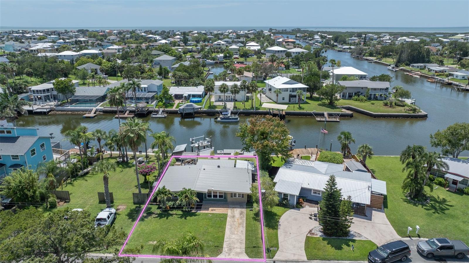 Coastal Hernando Beach Living at Its Finest!
Experience breathtaking sunsets every evening from your western-facing backyard in this beautifully updated 3 bedroom, 2 bath block home. With a sunroom and garage conversion under AC, you'll enjoy 1,421 sq ft of air-conditioned living space, plus abundant storage thanks to two large outdoor sheds in the rear.
Step inside and fall in love with the home's character and charm—from the cathedral ceilings in the living room and kitchen, to the luxury vinyl plank flooring, custom lighting, accent wall, and designer bathrooms. The kitchen is a showstopper with accent glass-front cabinets, new stainless steel appliances, and a welcoming eat-in island.
The oversized backyard is perfect for entertaining, featuring a pavered pergola area and space for a future pool. Boaters will love the 8k boat lift with Trek decking and floating dock with flow-through decking for direct Gulf access adventures.
Recent updates include: NEW metal roof (2025), NEW ACs (2024), double-pane windows, new electric panel, two new hot water heaters, and storm-resistant construction. Home can be sold partially furnished for a true move-in-ready experience. Property has transferable flood insurance.
Hernando Beach is a vibrant waterfront community that offers the best of coastal living-boating, kayaking, paddleboarding, fishing, and more. Just minutes from the world-famous Weeki Wachee Springs, residents also enjoy close proximity to shopping, dining, and hospitals. The community is golf cart friendly and allows short-term rentals with no HOA, no deed restrictions, making it perfect for full-time residents, part-time snowbirds, or investors. The Suncoast Parkway offers easy commuting to Tampa, Brooksville, and beyond. This is your chance to own a piece of paradise with unlimited potential and jaw-dropping views. Schedule your showing today, move in, relax, and enjoy breathtaking Gulf sunsets right from your own porch!