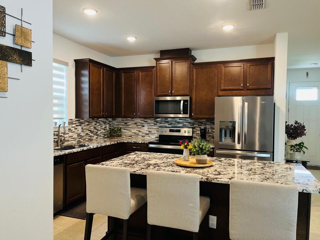 Photo of 8565 Lamppost Lane, Orlando, FL 32832 (MLS # O6394662)