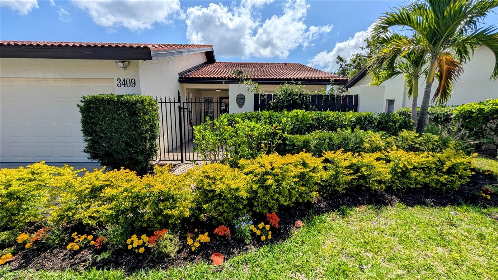 One or more photo(s) has been virtually staged. Beautifully RENOVATED villa situated on a dead-end street in the heart of Sarasota! This 55+ maintenance free community has it all! Enter through a private gate that leads to an open patio lined with brick pavers and sunshade. The open floor plan offers upgrades throughout including NEW plumbing through attic, tankless water heater, Bluetooth speaker in the master bath and more. The vaulted ceilings, expansive living dining areas, open kitchen and Florida room is a great use of space and feels like more than 1498 square feet! Custom kitchen has two toned cabinets, upgraded stainless steel appliances and extended granite countertops. Additional cabinets under the counter provide GREAT storage! Eat-in kitchen has plenty of room for stools, table and chairs. The enclosed Florida room leads to a screened garden and green landscaped views. Master bedroom has French doors, double custom closets leading to the master bath which boasts walk in shower and dual sinks. Inside laundry leads to 2 car garage with painted floors, outside storage cabinets with drawers, hurricane shutters and new garage door. The spilt plan has a guest bedroom with access to front patio and bath with tub shower combination. Resort style amenities steps away including the heated pool, sauna, clubhouse, fitness center, billiards room, library, pickleball courts and more. Enjoy the privacy of your Villa or the social events at Village Plaza. Minutes to Siesta Beach, Downtown, shopping and some of Sarasota’s finest restaurants!