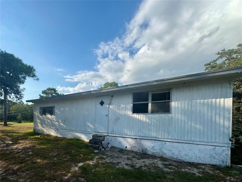 Photo of 16724 Gopher Hills Lane, Hudson, FL 34667 (MLS # W7879194)