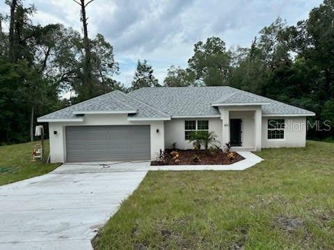 This beautiful Orange City home features many upgrades! The oversized kitchen includes stainless steel appliances, stunning quartz countertops, white shaker cabinets and a center island with breakfast bar. The split floor plan features a primary bedroom that includes massive walk-in closet, en-suite bathroom with dual sinks, and luxury tile walk-in shower. The spacious great-room boasts vaulted ceilings and open floor plan, great for entertaining family and friends. Other upgraded amenities include modern black hardware & finishes throughout, solar powered attic fan, "Low-E" windows and slider, garage door opener with battery backup, and more! Close proximity to 17-92 & I-4, shops, restaurants and other entertainment venues.